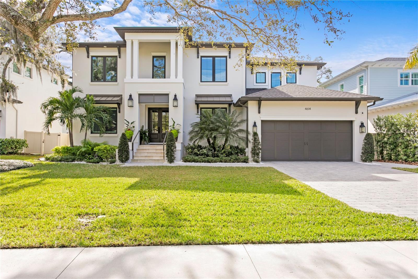Welcome to this exquisite custom-built home in the heart of Sunset Park, where timeless elegance meets modern luxury. From the moment you step through the glass paned double doors, you'll be captivated by 10-foot ceilings, intricate millwork, classic wainscoting, elegant crown molding, and rich hardwood floors throughout the entire house. Designed for both comfort and sophistication, this spacious home offers 5 bedrooms, including a first-floor guest suite, along with 4.5 baths. It features a formal dining room, a den, a formal living room with a gas fireplace and a great room with wood-beamed ceilings and French doors, blending indoor and outdoor living. At the heart of the home is the gourmet kitchen featuring custom cabinetry with 8" detailed banding, a 48" Wolf gas range, Sub-Zero refrigerator, built-in Bosch coffee station, Sub-Zero 24" wine fridge, and a spacious island with seating. A large walk-in pantry with butcher block counters offers exceptional storage. Upstairs, the primary suite is a true sanctuary, featuring a custom walk-in closet and a spa-like bath with a freestanding soaking tub, dual vanities, and a spacious walk-in shower. The second floor also includes a secondary en-suite bedroom, two additional bedrooms with custom closets sharing a Jack-and-Jill bath, and a laundry room with storage, a sink, and a folding station.
Step outside to the expansive lanai, where a travertine deck, wood ceiling, indoor-outdoor fireplace and a fully equipped outdoor kitchen with quartz countertops set the stage for effortless entertaining. Relax in the sparkling pool and spa, surrounded by a turf backyard with paver pathways, updated landscaping, a downspout drainage system, and a privacy fence-your own private retreat. With luxury finishes, thoughtful design, and state-of-the-art features like a whole house surround sound system and advanced video monitoring, this exceptional home is the epitome of upscale living. Schedule your private tour today!