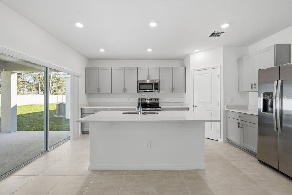 Photo of 13514 Tropical Breeze Way, Hudson, FL 34669 (MLS # TB8437937)