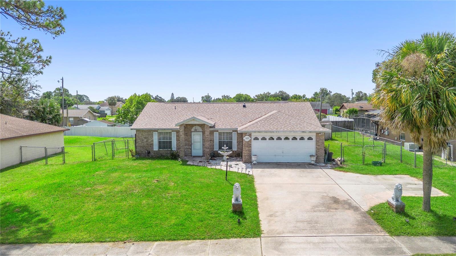 Welcome to Deltona Lakes! This charming home features 3 bedrooms, 2 bathrooms, and 2-car garage. The living room and dining room are open concept, leading to the upgraded kitchen with granite countertop, new cabinetry, and stainless-steel appliances, featuring elegant lighting fixture. The spacious closed-in patio has a wall A/C unit and built-in closet, great space for a bedroom or game room, whatever your hearts desires. Spacious master bedroom featuring a walk-in closet and a private bathroom. A new roof was installed in 2023 and includes a home warranty. The water heater and A/C were also replaced in 2023, and the septic tank is five years old. The electrical panel is the original. The home also comes with a water softener, owned, not leased. Porcelain tiles throughout the home. Conveniently located close to all shopping centers, medical centers, restaurants, hospitals, schools, parks, and I-4. The location of this property has easy access to Orlando and Daytona Beach. A Must See! Great Location! Schedule your showing Today!
