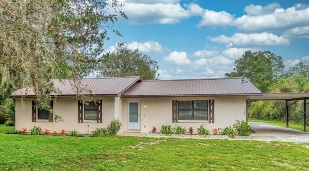 Photo of 11301 Huggins Street, Leesburg, FL 34788 (MLS # S5148654)