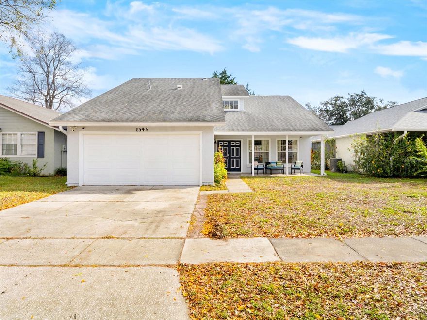 Enjoy the convenience of living just minutes from top-rated schools, colleges, shopping, and major highways in this beautifully updated, light-filled home set within a well-established, family-friendly lakefront community. The home features 2018 roof, fencing, and plumbing. The interior paint, fully remodeled kitchen with appliances, half bath updates and tile flooring were completed in 2021. Exterior was painted 2025. Community has private access to Tennis court, lake front park and playground. Additional highlights include a top-of-the-line whole-home power generator, reverse osmosis water filtration system, security cameras, and a new thermostat. Vaulted ceilings and abundant natural light enhance the spacious living and dining areas. The kitchen offers space for a breakfast nook. Sliding doors lead to a screened-in patio accessible from both the kitchen and family room. A convenient half bath is located downstairs.