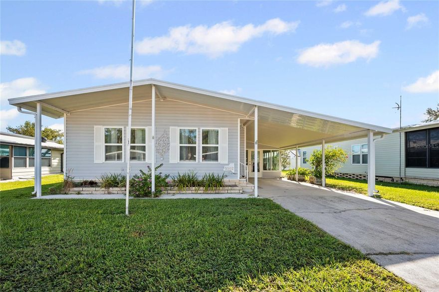 Welcome to your Florida retreat. This delightful 2-bedroom, 2-bath manufactured home is nestled in a sought-after 55+ pet-friendly community where you OWN the land. Whether you’re escaping the cold winters or looking for your year-round residence, this home and community have everything you need to embrace the Florida lifestyle. Step inside to find a bright, open-concept floor plan that connects the living, dining, and kitchen areas, creating a warm and inviting space for entertaining family and friends. The kitchen provides ample cabinetry and counter space, perfect for any home chef. The owner’s suite includes a private en-suite bath, while the guest bedroom and second bath provide plenty of room for visitors. Enjoy your morning coffee or evening breeze from the bright Florida room, the perfect place to unwind after a day of fun in the community. Covered parking and a storage shed add extra convenience. This vibrant community encourages an active lifestyle—bring your golf cart and explore! Residents enjoy access to a clubhouse, heated swimming pool, shuffleboard courts, and a full calendar of activities. Whether it’s social gatherings, games with neighbors, or relaxing poolside, there’s something for everyone. Don’t miss your chance to own a piece of paradise in sunny Florida. Just pack your bags, bring Fido, and start enjoying life the way it’s meant to be—relaxed, social, and full of sunshine!
