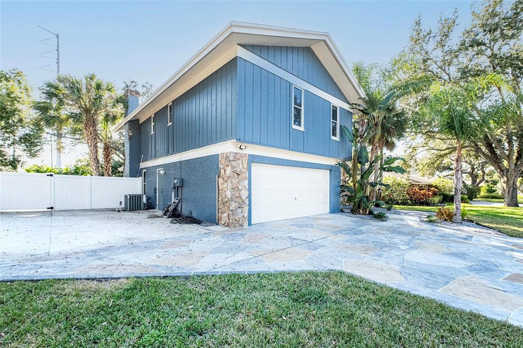 Photo of 1599 Brae Moor Lane, Dunedin, FL 34698 (MLS # TB8462484)