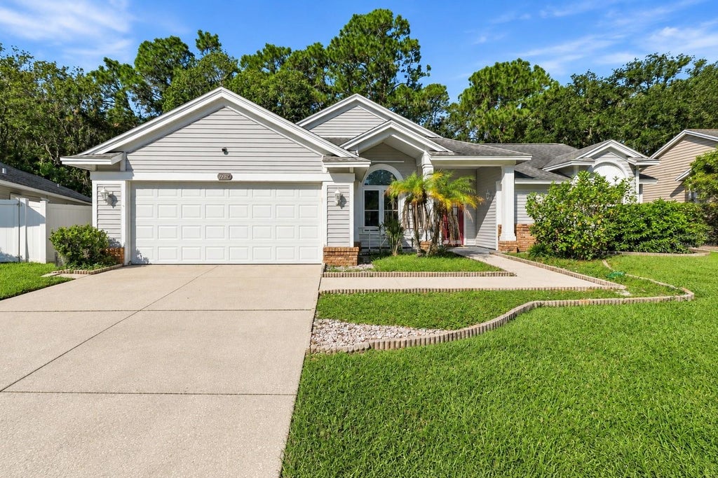 Photo of 7828 Lake Placid Lane, New Port Richey, FL 34655 (MLS # TB8558402)
