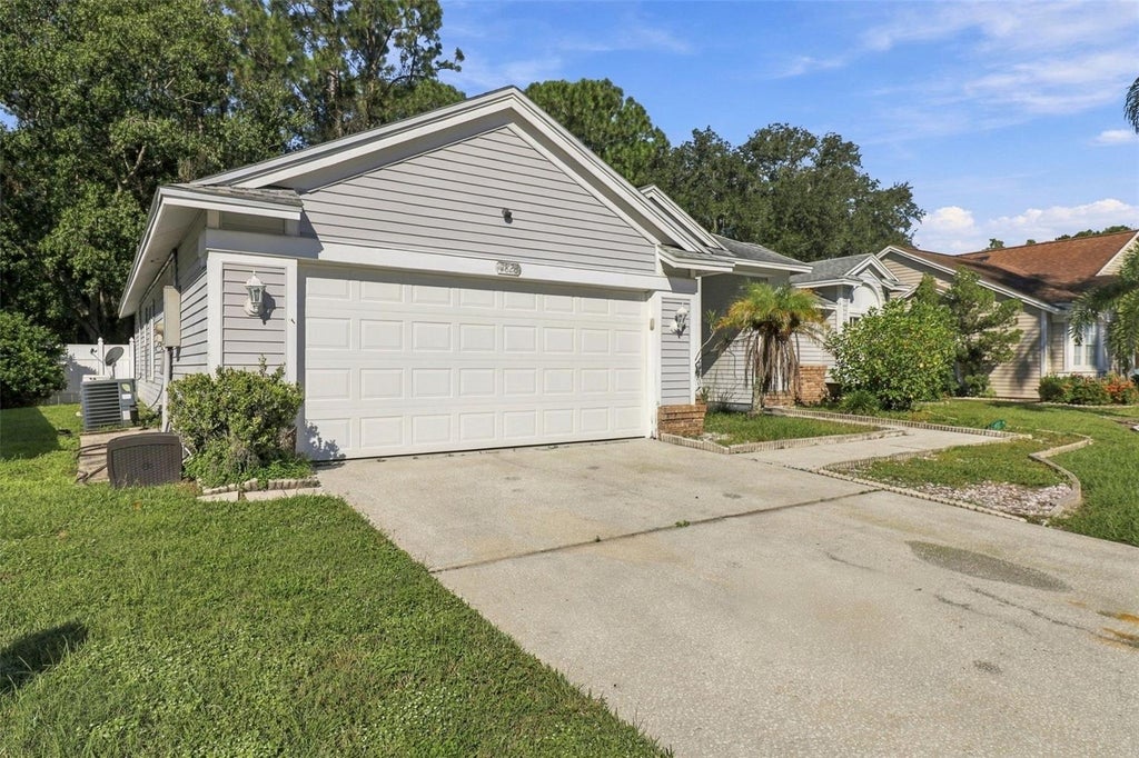 Photo of 7828 Lake Placid Lane, New Port Richey, FL 34655 (MLS # TB8558402)