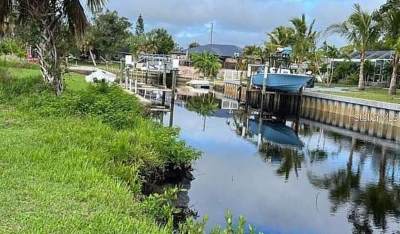 Location, Location, Location! This waterfront lot in the Suncoast Development is a rare opportunity you don’t want to miss. With 60 feet of water frontage, direct access to the Peace River, Charlotte Harbor, and the Gulf, it’s a perfect spot for boaters, anglers, or anyone who loves living close to nature. The property is located in a quiet dead-end development, offering peace and privacy, and there are no HOA fees or deed restrictions, giving you complete freedom to design your dream home your way. Conveniently close to key amenities yet surrounded by serene natural beauty, this lot offers the ideal balance of convenience and escape. The owner is motivated—call today before it’s gone!