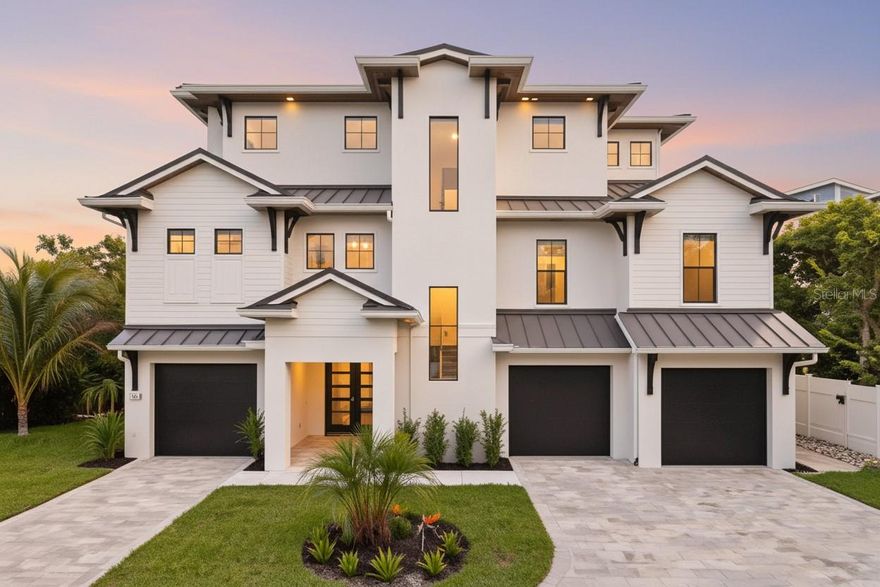 Introducing a stunning, move-in ready 2025 waterfront masterpiece tucked along a tranquil canal on a quiet street in the heart of Siesta Key - just minutes from the lively Village and the world-famous white-sand beaches that are consistently ranked among the very best.Designed for the ultimate coastal lifestyle, this elevated luxury residence blends modern craftsmanship with timeless elegance, offering both a serene retreat and an entertainer’s dream, all while providing unparalleled privacy and direct waterfront access. Spanning 4,009 square feet of impeccably designed air-conditioned living space, plus more than 2,000 additional square feet of versatile non-conforming area, this home is perfectly suited for every chapter of your life. With five spacious bedrooms, four full baths, two half baths, and a flexible bonus room, there is room for extended family, guests, or a home office. The rare six-car garage ensures plenty of storage for vehicles, golf carts, or recreational gear, while the additional non-conforming space can easily transform into a golf simulator lounge, private gym, wine cellar, or a state-of-the-art home theater - your imagination is the only limit. Outside, the property feels like your own private resort. Step into lushly landscaped surroundings designed for beauty and privacy, where the sound of palms swaying and water gently lapping the canal creates a calming backdrop. The resort-style pool invites endless afternoons of relaxation, while the outdoor kitchen makes al fresco dining and entertaining effortless. Multiple covered balconies provide shaded retreats for morning coffee or evening cocktails, and the expansive rooftop patio becomes your sanctuary for breathtaking panoramic views—watch the sun rise over the bay, then return for unforgettable Gulf sunsets that melt into the horizon. With a brand-new dock just steps away, boating enthusiasts will relish the quick access to Sarasota Bay and the Gulf of Mexico for fishing, cruising, or island hopping. Inside, every detail is elevated to luxury standards. The gourmet kitchen is a chef’s dream, featuring custom white cabinetry, gleaming quartz countertops, a six-burner professional range with dual ovens, and top-tier stainless appliances. Wide-plank hardwood flooring flows throughout the home, creating warmth and sophistication, while hurricane-rated impact windows and doors provide peace of mind during storm season. The master retreat is nothing short of indulgent, with dual walk-in closets, private balcony access, and a spa-inspired bath showcasing a freestanding soaking tub, a massive walk-in shower, and finishes that rival five-star resorts. Beyond the stunning features, what truly sets this property apart is the lifestyle it offers. Imagine walking to the prestigious Out-of-Door Academy or biking to Siesta Key Village for a lively evening of dining and music. Spend mornings strolling along the powdery sands of Siesta Beach, afternoons boating with friends, and evenings entertaining under the stars on your rooftop terrace. Whether you seek the perfect primary residence, a luxurious vacation retreat, or an investment in one of Sarasota’s most coveted waterfront locations, this home captures the essence of island living at its finest. Elevated design, hurricane-rated construction, world-class finishes, and an unbeatable location come together here to create the ultimate expression of the Siesta Key lifestyle.