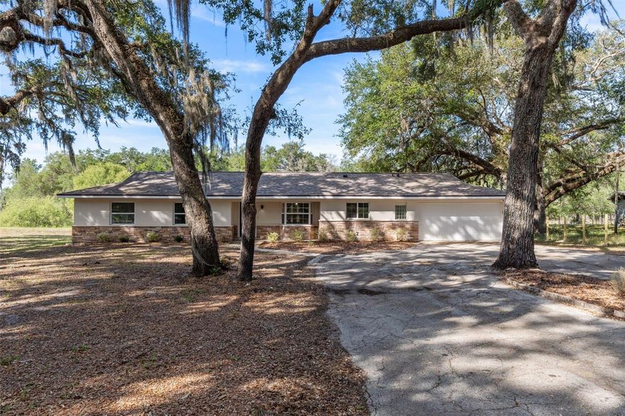 One or more photo(s) has been virtually staged. Completely Remodeled Canal-Front Home On Nearly Half An Acre With Modern Upgrades Throughout! This Beautifully Updated 3 Bedroom, 2 Bathroom Home Offers 1,536 SF Under Air And Features An Open Floorplan With Vaulted Ceilings, Recessed Lighting, And Stylish Finishes From Top To Bottom. The Fully Renovated Kitchen Is The Heart Of The Home, Showcasing Custom Soft-Close Cabinetry With 42" Uppers, Drawer Base Cabinets On The Island, Brown Fantasy Stone Countertops, A Custom Range, Drawer Microwave, And New Stainless Steel Appliances. The Spacious Primary Suite Includes Dual Sinks, Counter-Height Vanities, Double Closets, A Barn Door Accent, And A Walk-In Shower. Guest Bathroom Features A Tile Shower/Tub Combo. Generous Sized Bedrooms And An Inside Utility Room Add To The Home's Functionality. Major Updates Include A New Roof (2024), New AC (2025), New Water Heater (2025), New LVP Flooring Throughout, New Garage Door (2014), And Pella Double Pane Windows (2012). Enjoy The Florida Lifestyle Year-Round In The Florida Room (2015) Complete With Real Windows And Screens. Situated On A Canal Between Lake Elizabeth And Lake Geneva With No Rear Neighbors, This Property Offers Privacy And Scenic Views. Exterior Features Include A Circular Driveway, Paver Apron To The Garage, Cobblestone Walkway, Stone Accents, Mature Oaks, And An 11x12 Shed With Upper Storage. The Oversized 2-Car Garage Includes An Opener, Wash Sink, Workshop Area, And Rear Yard Access. Located On Public Water With Newly Paved Roads, This Move-In Ready Home Combines Quality Upgrades, Space, And A Prime Waterfront Setting. -Ideally located near I-75 and SR-50, easy access to Brooksville, Wesley Chapel, and Tampa. Enjoy nearby outdoor recreation including the Withlacoochee State Forest, local trails, rivers, and springs--all while being just about 45 minutes from Tampa International Airport. This move-in ready home combines comfort, style, and location--don't miss your opportunity to make it yours!