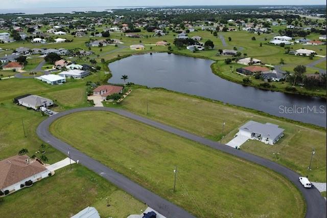 Here is the perfect lot for you to build your dream home, amazingly located off Burnt Store Rd in the quiet community of Burnt Store Lakes close to restaurants and shopping. Pick between southwestern or northeastern exposure. Take your golf cart to the first hole. Adjacent lot is 17471 Vellum Cir is for sale, seller wants package purchase. Seller will consider Financing depending on short terms, offer and qualified Buyers. Burnt Store Lakes is a beautiful deed-restricted community with many new construction homes currently being built throughout the community. As a Burnt Store Lakes resident, you can leisurely kayak on the lakes and enjoy the multitude of tropical birds and wildlife that share this naturalistic setting! Enjoy Burnt Store Lakes' amenities of park with playground or the new kayak/canoe launch which leads to Charlotte Harbor where you easily observe the wildlife. Golf, Marina, Activity Center, Fitness Center and Restaurants can be enjoyed at next door neighboring Burnt Store Marina, which is SW Florida's immediate harbor access, full service, deep water marina. With Burnt Store Road widening to four lanes, downtown Punta Gorda is easily accessible and there you will find a plethora of in-town activities, restaurants and convenience to enjoy.