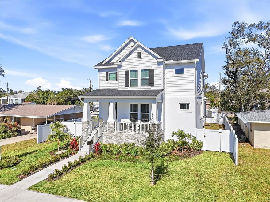 Built in 2025 by the highly respected David Weekley Homes, this exceptional new construction residence blends enduring craftsmanship with refined, magazine-worthy design—set in one of St. Petersburg’s most convenient and connected locations. At the heart of the home is an entertainer’s dream kitchen, thoughtfully designed to anchor everyday living and elevated gatherings. An oversized island with bar seating for four or more invites conversation, while a vented hood, expansive pantry, and beautifully appointed coffee and beverage bar deliver both form and function. Just beyond, the living room is enhanced by custom shiplap millwork, adding warmth, texture, and architectural interest that elevates the space and creates a polished focal point. The open floor plan allows the kitchen, living, and dining areas to flow seamlessly together, enhancing natural light and a sense of ease throughout. A highly desirable feature of the home is the main-level bedroom with an ensuite bathroom and step-in shower, ideal for guests, multigenerational living, or a private home office. Upstairs, the bedroom layout is equally impressive. The primary suite is generously scaled—large enough to comfortably accommodate a private sitting area—and is complemented by a dreamy ensuite bathroom and an idyllic walk-in closet designed for both luxury and organization. Additional bedrooms are well-proportioned and thoughtfully placed, while a versatile loft space provides the flexibility to serve as a secondary TV or game room, personal gym, music room, or art and craft studio. A true standout is the rear-entry, attached two-car garage, featuring exceptionally high ceilings ideal for large vehicles, additional storage, or future customization. Outdoors, the fully fenced yard offers ample space for play, relaxation, pets, and the opportunity to create your own custom pool oasis. Built for peace of mind as much as beauty, the home includes hurricane-resistant windows, durable Hardie board siding, and a remaining transferable builder’s warranty—a testament to David Weekley Homes’ stellar reputation for quality. Perfectly positioned less than 10 minutes from downtown St. Petersburg, and within walking distance to Whole Foods, parks, kayak and boat launches, this home delivers a lifestyle defined by thoughtful design, trusted construction, and refined Florida living.