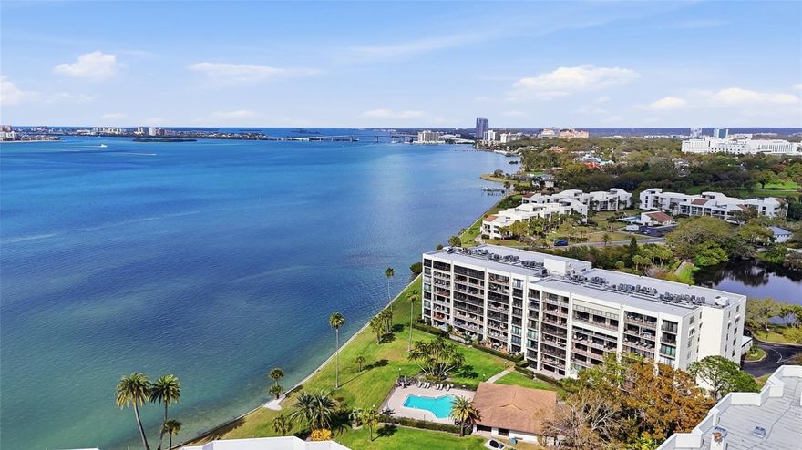 Prepare to be wowed! LUXURY, LOCATION and LIFESTYLE converge in this impeccably and COMPLETELY renovated residence inside the prestigious guard-gated community of Belleair Country Club.  This spectacular 2-bedroom, 2-bath coastal retreat is MOVE-IN ready and perfectly positioned to capture breathtaking water views and ENDLESS FLORIDA SUNSETS!
The stunning 2025 luxury renovation introduces porcelain tile flooring throughout, crown molding, elegant baseboards, a NEW HVAC system, water heater and custom steel entry doors—creating a refined yet comfortable coastal atmosphere. Offered fully furnished (optional)—from HIGH-END FURNISHINGS...right down to the dishes, (complete list available). A grand double-door entry welcomes you into a beautifully reimagined interior where every detail has been thoughtfully curated. 
The designer kitchen is the heart of the home, featuring custom cabinetry, quartz countertops, a stylish tiled backsplash, stainless steel appliances, recessed lighting, and a spacious island with seating—ideal for both everyday living and entertaining.
Both bathrooms have been fully redesigned with sophisticated finishes. The primary suite offers custom closet systems, a lighted makeup vanity, and a double-sink ensuite bath. The guest bath features a custom walk-in shower with frameless glass enclosure, modern fixtures, and elegant wainscoting.
Additional 2026 upgrades include hurricane-rated sliding doors, new Pella windows, fresh neutral interior paint, and upgraded, two panel, double steel entry doors (paid for and scheduled to be installed)—providing both peace of mind and timeless style. A ventless washer and dryer adds convenient in-unit laundry.
Located just steps from the pool and clubhouse within the Bayshore I building, residents enjoy manicured grounds, sparkling water views, and spectacular sunset skies. The property also includes an assigned covered carport parking space and secure lobby entry with video monitoring.
Ownership within the 24/7 guard-gated community places you alongside the historic Belleview Inn and offers an extraordinary lifestyle. Residents are eligible for immediate golf membership, bypassing the current six-year waiting list, with a discounted initiation fee. A private marina with boat slips is also available for rent or purchase (subject to availability).
Ideally located in the charming town of Belleair, residents enjoy a community known for its private police department, recreation center, and peaceful coastal setting—just minutes from the beaches of Clearwater Beach, the shops and dining of Dunedin and St. Petersburg, and only 30 minutes to Tampa International Airport.
This extraordinarily priced residence offers luxury renovation, stunning views, and the exclusive Belleair lifestyle—all in one exceptional opportunity. Schedule your private showing today.