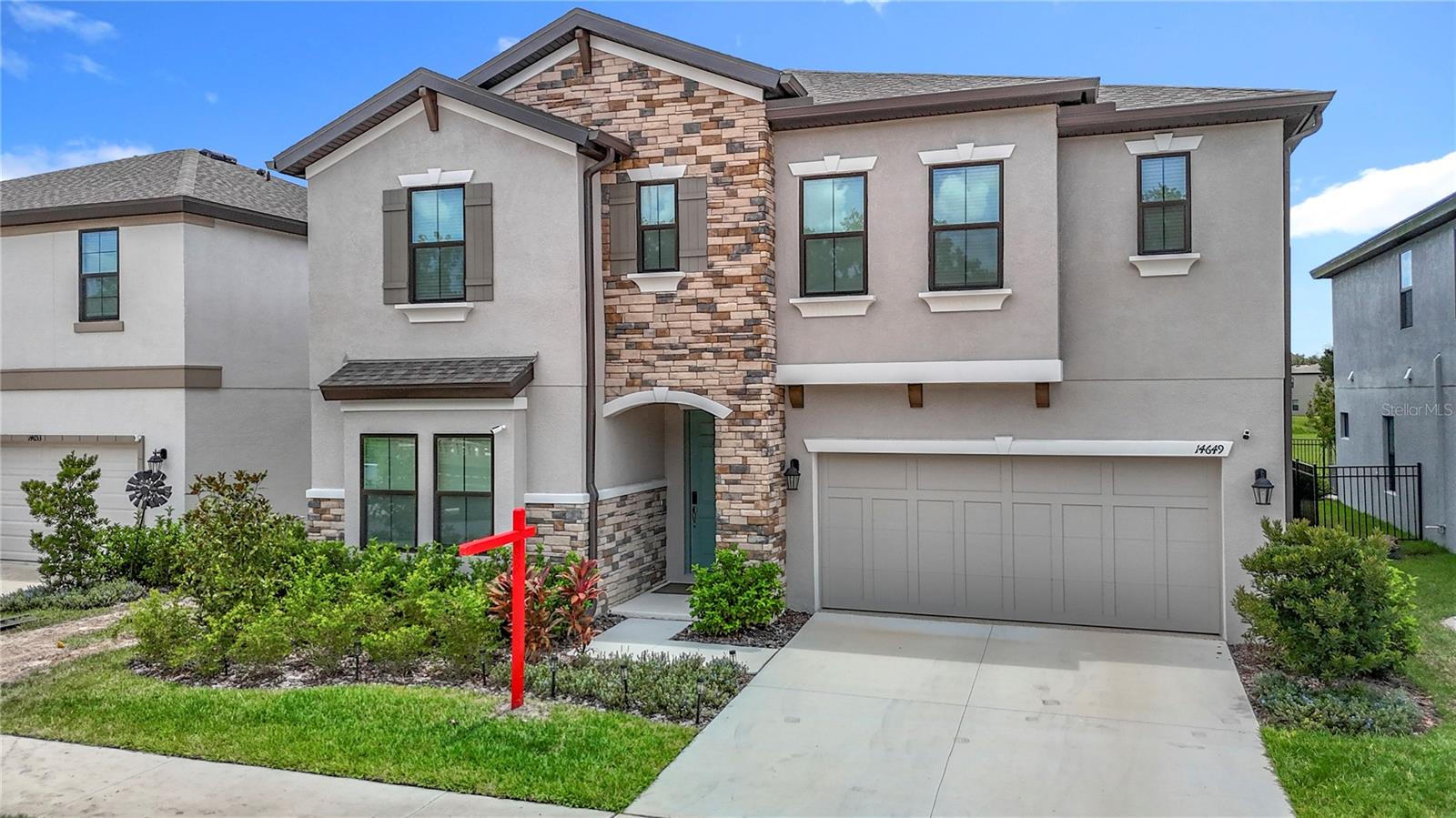 Welcome to your dream home in the desirable Hawkstone community, where luxury and convenience intertwine to create the perfect family home! This stunning 5-bedroom, 3-bathroom residence offers a luxurious and comfortable lifestyle. Prepare culinary masterpieces in the huge, open gourmet kitchen, complete with a central island and gleaming stainless steel appliances. Host elegant dinners in the separate dining room, and enjoy family movie nights in the expansive upstairs bonus room – perfect as a game room or home theater! The versatile floorplan features a convenient downstairs bedroom, along with three spacious guest bedrooms and a luxurious master suite upstairs. Indulge in the master bathroom, boasting a separate walk-in shower, soaking tub, and dual vanity sinks. Step outside and entertain guests in your private, screened-in lanai and fully gated backyard. This home is loaded with upgrades, including ceiling fans throughout, a water softener, and recently added gutters. Hawkstone residents enjoy resort-style amenities with two pools, pickleball courts, and parks, all within top-rated school zones. Plus, you're just minutes from US-301, I-75, and the breathtaking Triple Creek Preserve. Nature lovers will appreciate the pet-friendly hiking trails at the 969-acre Triple Creek Nature Preserve, less than 2 miles away, while thrill-seekers can test their skills at Triple Creek BMX, just 1 mile from your doorstep. Don't miss this opportunity to live in a prime location with exceptional amenities!