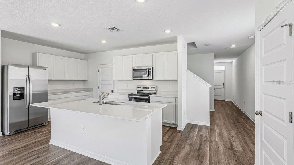 Photo of 5588 Taverna Loop, Winter Haven, FL 33884 (MLS # O6428736)