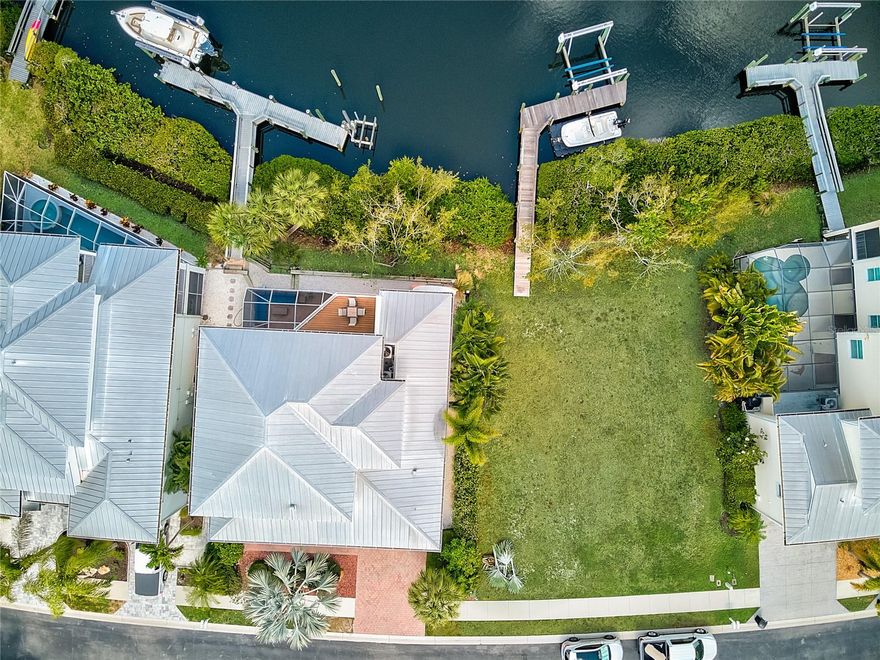 Build the lifestyle you’ve dreamed on this waterfront lot in highly sought after Shakett Creek Pointe. Gated and upscale, Shakett Creek Pointe is a Key West style private enclave offering ideal protected boating with just two bridges to Roberts Bay, the ICW, and the Gulf of Mexico. Ready to build on with beautiful scenic water and preserve views and includes a private boat dock with lift. Just minutes from I-75 access and the New Sarasota Memorial-Venice Hospital. This private setting is convenient to numerous restaurants, boutique shops, cultural attractions and airports. SELLER HAS FLOOR PLANS & ELEVATIONS SPECIFIC TO THE LOT for a 3,467 sf 3 bedroom 2 bath POOL HOME as well as an BUILD ESTIMATE from a HIGH-END BUILDER. Ask your agent for details.