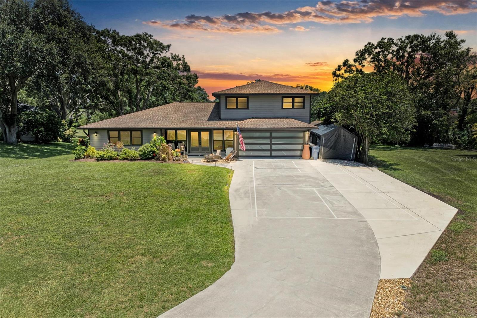 Welcome to the highly sought after community of Braden Woods! This beautiful, lakefront home has 5 bedrooms, 2.5 baths, tons of upgrades, a pool with screened lanai and covered space, and plenty of room for boat or RV. This home has a gorgeous kitchen recently renovated to include a 15 foot island, granite countertops, an added walk in pantry, refaced cabinets, and black stainless appliances. Primary bathroom renovated in 2024 with new sink, toilet, countertop, shower glass, and a custom primary closet. All windows, doors, and garage door replaced in 2018 and are all impact rated. Newer flooring in dining room, primary and additional four bedrooms, and remodeled upstairs bath. Driveway expanded, lanai re-screened and re-cabled, an added shed for outdoor equipment storage, foam insulation in attic, and much more!! This home is a family paradise, perfect for entertaining guests, with amazing lake views, and surrounded by acre plus size properties, giving an estate feel throughout the neighborhood. All of this conveniently located near restaurants, shopping, UTC Mall, downtown Lakewood Ranch, Sarasota, SRQ Airport, I-75, and the world famous beaches of Florida's Gulf Coast!!