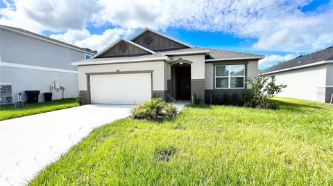 Photo of 557 Scott Lake Creek Lane, Lakeland, FL 33813 (MLS # O6401273)