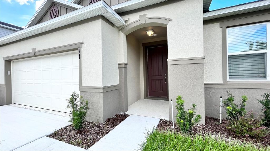 Photo of 557 Scott Lake Creek Lane, Lakeland, FL 33813 (MLS # O6401273)