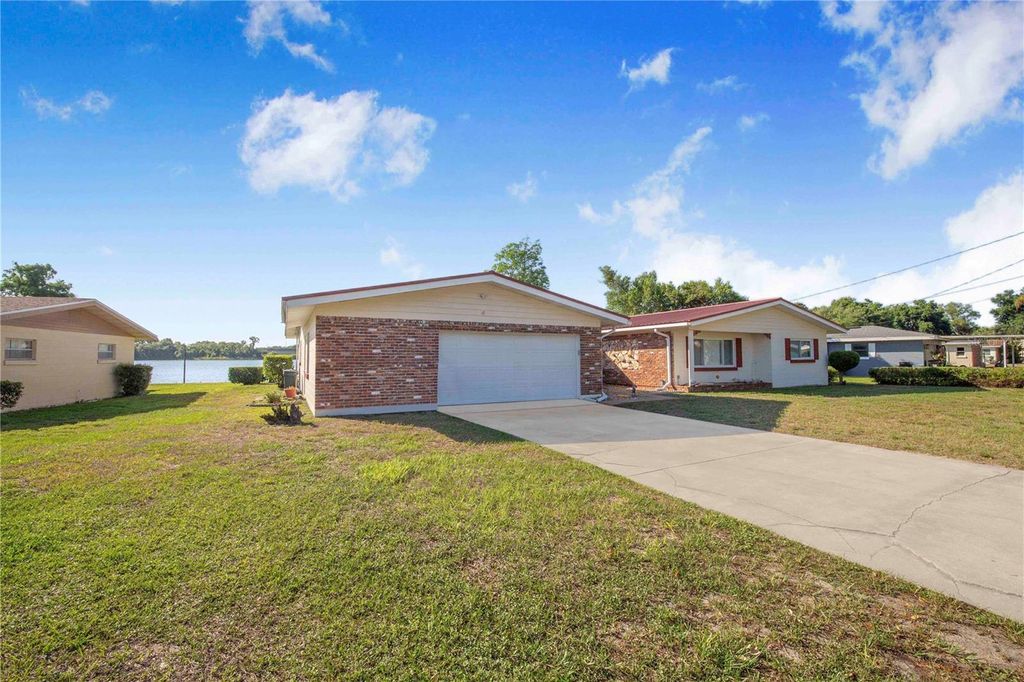 Photo of 1212 W Lake Buckeye Drive, Winter Haven, FL 33881 (MLS # L4961610)