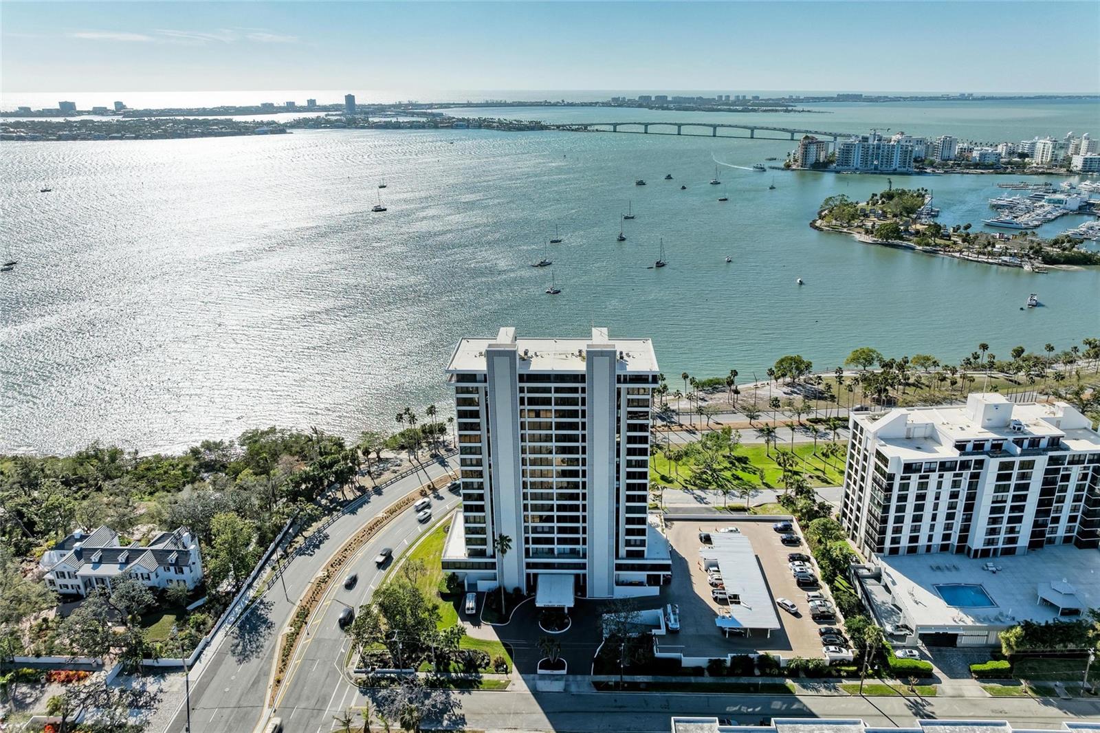 Located on the fourth floor of the renowned Embassy House, this immaculate 2-bedroom, 2-bathroom condo offers the epitome of luxury living in downtown Sarasota. Positioned front-row to the sea, with breathtaking panoramic views of Sarasota Bay and Bayfront Park, this residence is a true showcase of Sarasota’s finest waterfront living. Situated along Bayfront Drive and the scenic promenade, it boasts an unrivaled location that places the best of the city at your doorstep.
As you enter, you are greeted by a thoughtfully designed space bathed in natural light, with expansive windows framing stunning views from every room. The living area is bright and open, featuring Spanish tile flooring and remote-controlled see-through and manual sun shades by Hunter Douglas. Sliding doors lead to a balcony equipped with wall-mounted cabinets and remote-control see-through shades, offering world-class vistas of the bay. The dining area seamlessly connects to the living space, enhancing the feeling of openness while providing captivating views of Sarasota Bay.
The well-equipped kitchen is designed for both practicality and comfort, featuring brand-new cabinetry, Spanish tile flooring, wrap-around lighting, and designer ceiling lights that add a touch of elegance. The high-efficiency, extremely low-noise air conditioning unit, equipped with three UV rods for clean air, ensures a comfortable atmosphere throughout the residence. Additionally, a six-month-old water heater provides peace of mind.
The primary suite is a true retreat, offering ample natural light, high-end tile flooring, and wrap-around cabinetry for added storage. The remote-controlled two-level shades, one for full closure and one for light filtering, allow for complete customization of ambiance. It further features an en suite bathroom complete with a tub and shower combination.
The second bedroom features wall-mounted cabinet space and a walk-in closet with wrap-around drawers, ensuring optimal organization. The second bathroom is tastefully designed with a spacious walk-in shower and ample vanity space for added convenience. Throughout the condo, the ceiling has been completely soundproofed, the entire residence was freshly painted three years ago, and the washer-dryer area is enclosed with double soundproof doors, ensuring tranquility in every corner.
Embassy House has undergone updates, transforming its first-floor common areas while maintaining the building’s iconic mid-century modern architecture. Residents enjoy an array of amenities, including a saltwater swimming pool, fully equipped gym, catering kitchen, herb garden, and outdoor grilling area.
Step outside and experience the best that Sarasota has to show. With downtown Sarasota just five minutes away, you’ll have easy access to Palm Avenue’s Gallery Row, fine dining, antique shops, and luxury salons. World-class beaches, including the renowned Siesta Key Beach just 6.5 miles away, are within easy reach. The lush Marie Selby Botanical Gardens and all the culture and entertainment that downtown Sarasota is known for are at your doorstep. This exceptional condo blends luxury, location, and lifestyle in a way few others can, making it an opportunity that should not be missed.