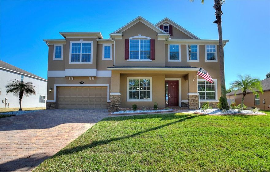 Welcome to your dream home in the beautiful gated community of The Estates of Auburndale! This beautiful one-owner residence boasts five bedrooms and four and a half baths in a cul-de-sac. All bedrooms have walk in closets. The gourmet kitchen is a chef’s dream, featuring elegant granite countertops, double wall ovens, a sleek cooktop stovetop and walk-in pantry. The first-floor bedroom with an en-suite bathroom is perfect for guests or a mother-in-law suite. The spacious backyard features a gorgeous, heated saltwater pool with a hot tub, surrounded by a vinyl fence—ideal for relaxation and entertaining. Additional highlights include a cozy den for a home office, a spacious three-car garage, and a fabulous theater room on the second floor complete with a projector and screen.  Plus, enjoy convenient access to I-4, making travel to Orlando or Tampa a breeze. Seller is offering a home warranty for added peace of mind. All measurements are approximate, and buyers should verify. Don’t miss the opportunity to make this exceptional property yours!