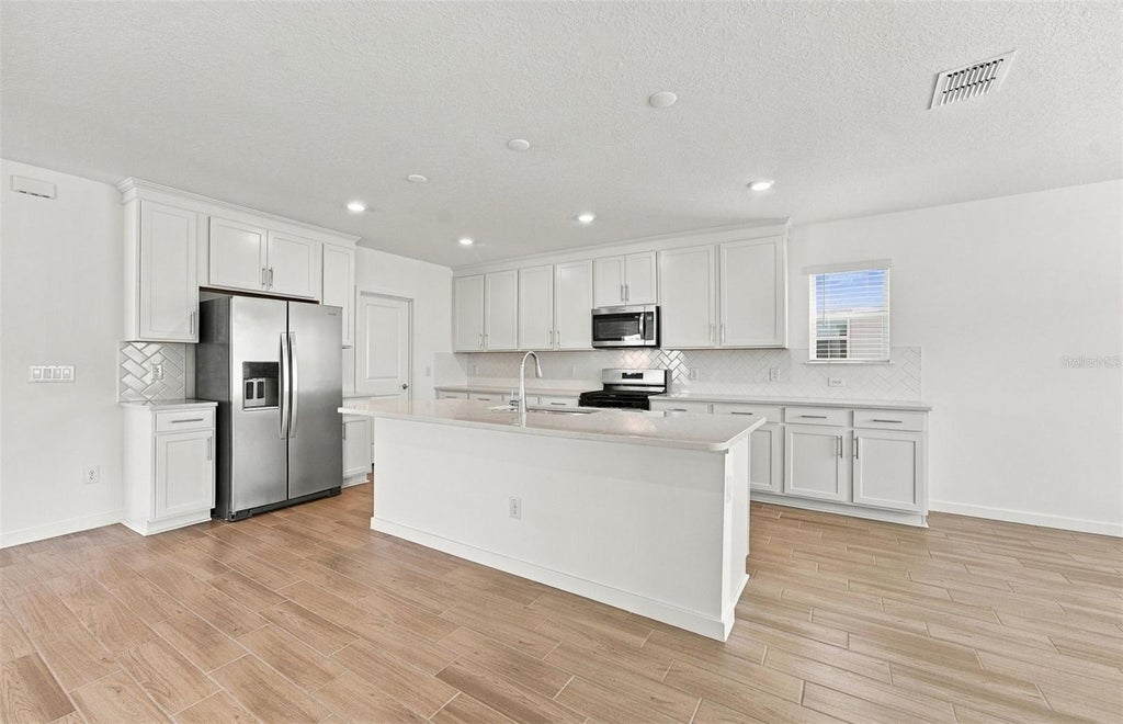 Photo of 33506 Barnebrook Drive, Wesley Chapel, FL 33545 (MLS # TB8542437)