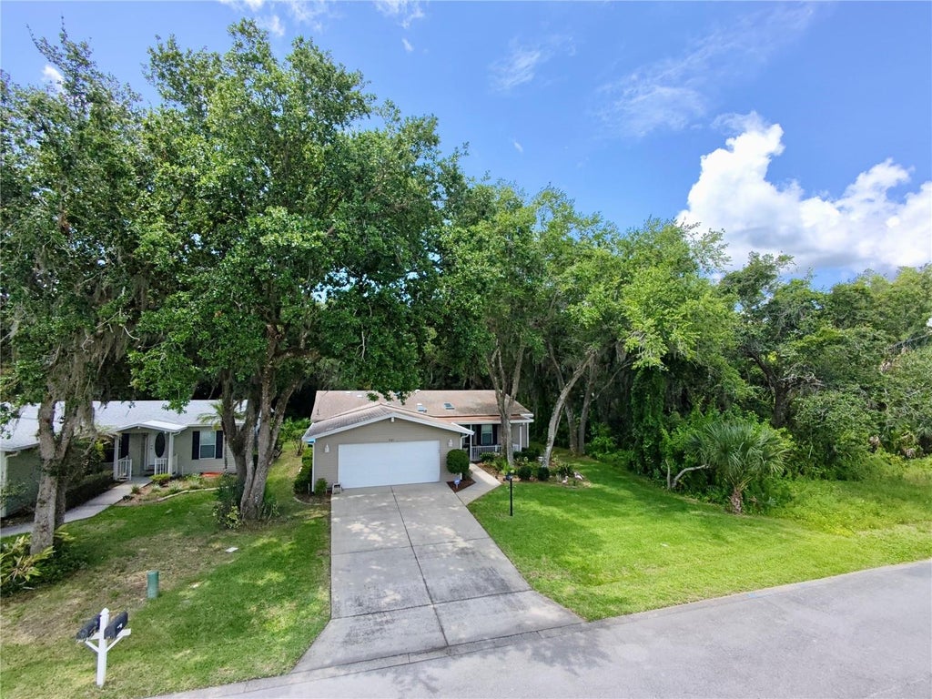 Photo of 301 Water Landing Drive, Oak Hill, FL 32759 (MLS # NS1088621)