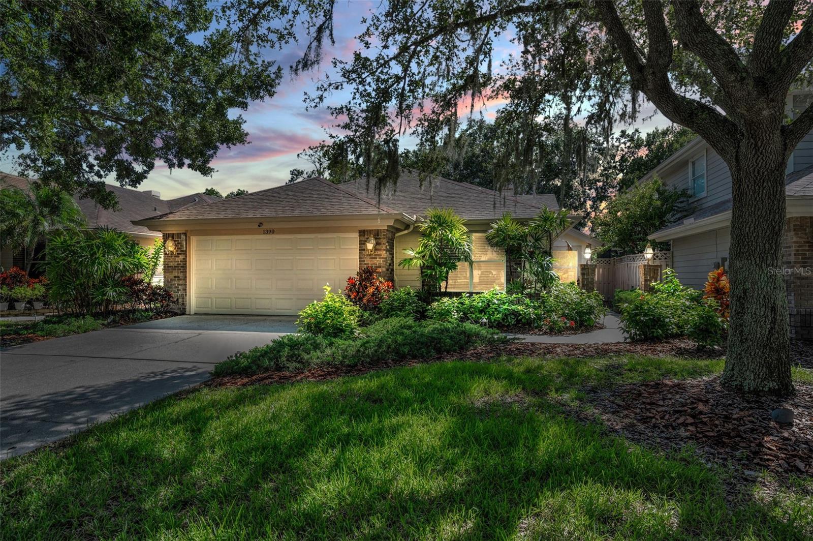 What a View! This 3 Bedrooms, 2 Full Baths, 2 Car Garage home is located in Cross Creek in East Lake Woodlands Community. Once you arrive you will notice the lush landscaping that brings you to the front door. As you enter there are soaring lace ceilings throughout and tile flooring in the foyer. Just off the foyer you have double door entry into the 3rd bedroom, den or office that already has built in bookcases in place. The living & dining rooms has carpet, ceiling fan, wood burning fireplace w/mantle for those chilly nights and a triple slider to the lanai. The kitchen has wood cabinets w/pullout shelves, lazy susan, stainless steel appliances and a wonderful breakfast area. There is a hallway that has a large closet, and it brings you to the guest bedroom w/carpet and the guest bathroom has wood vanity, tub w/shower and linen closet. The primary bedroom has plenty of room for all your pieces, ceiling fan, carpet and a slider to lanai. The primary bathroom has wood vanity w/drawers, walk in shower, toilet closet, two walk in closets and a garden tub to relax in. There is a laundry room w/washer, dryer and cabinets. The 2-car garage has pulldown staircase to attic and cabinets for storage. You and your guests are going to enjoy the fabulous view of pond & forest from either the large, screened lanai w/ceiling fans or the outside patio! This home has hurricane fabric panels too. Conveniently located near area restaurants, shopping, beaches & airports and a potential to join the Andrea Country Club for golf, tennis, pickleball, pools, fitness center, restaurant & events.