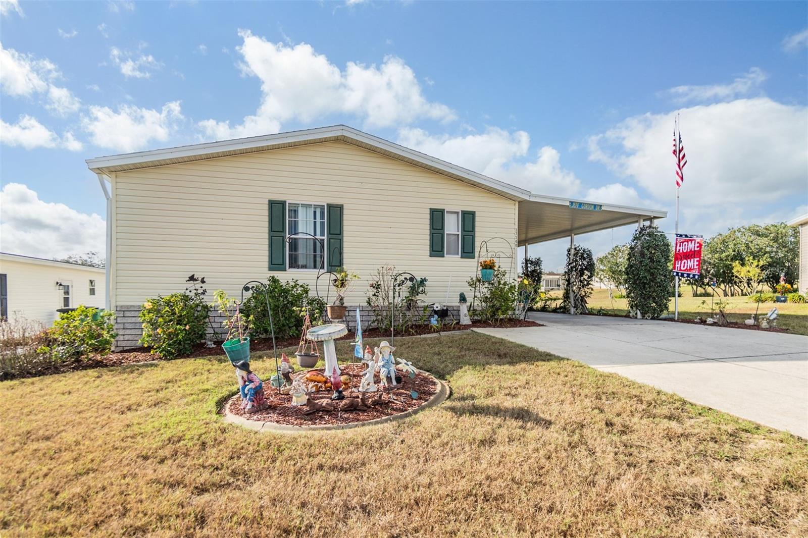 Discover your dream home in the beautiful gated community of Grand Horizons, where you OWN your land! This charming manufactured home features a host of impressive features, including a brand-new ROOF replaced in September 2021 for $7,500. The convenient galley kitchen is equipped with a 2024 dishwasher and disposal, along with a range and microwave that are just six years old. Enjoy peace of mind with a six-year-old AC unit, complete with a 10-year warranty. The home features inviting laminate floors in the kitchen, dining area, and foyer, enhancing its overall appeal. With two spacious bedrooms and a versatile den/office/flex room, there's plenty of space to relax and entertain guests. The owner's suite offers a luxurious experience with a wall-to-wall mirrored closet and a well appointed ensuite bath featuring a shower with a seat and a stylish tile floor. The eat-in dinette area connects seamlessly to an enclosed Florida room through sliding doors, creating a perfect space for entertaining. The washer and dryer convey with the home, accompanied by convenient shelving for additional storage. Step into the 12 x 14 sunroom, featuring sliding windows and AC, where you can bask in natural light with no rear neighbors to interrupt your tranquility. The guest bath has a charming skylight and a deep linen closet for added convenience. Some furnishings are negotiable, allowing you to move right in! Enjoy the Resident owned amenities in this 55+ Community: Heated Pool, hot tub, Clubhouse with Commercial kitchen, Library with books, games, movies and puzzles, Craft room for sewing, quilting and crafting, shuffleboard, darts, billiards, cornhole, bocce, planned activities, potluck dinners, onsite entertainment, travel excursions and events! This is a fantastic opportunity to own a piece of paradise in Grand Horizons! CALL TODAY!