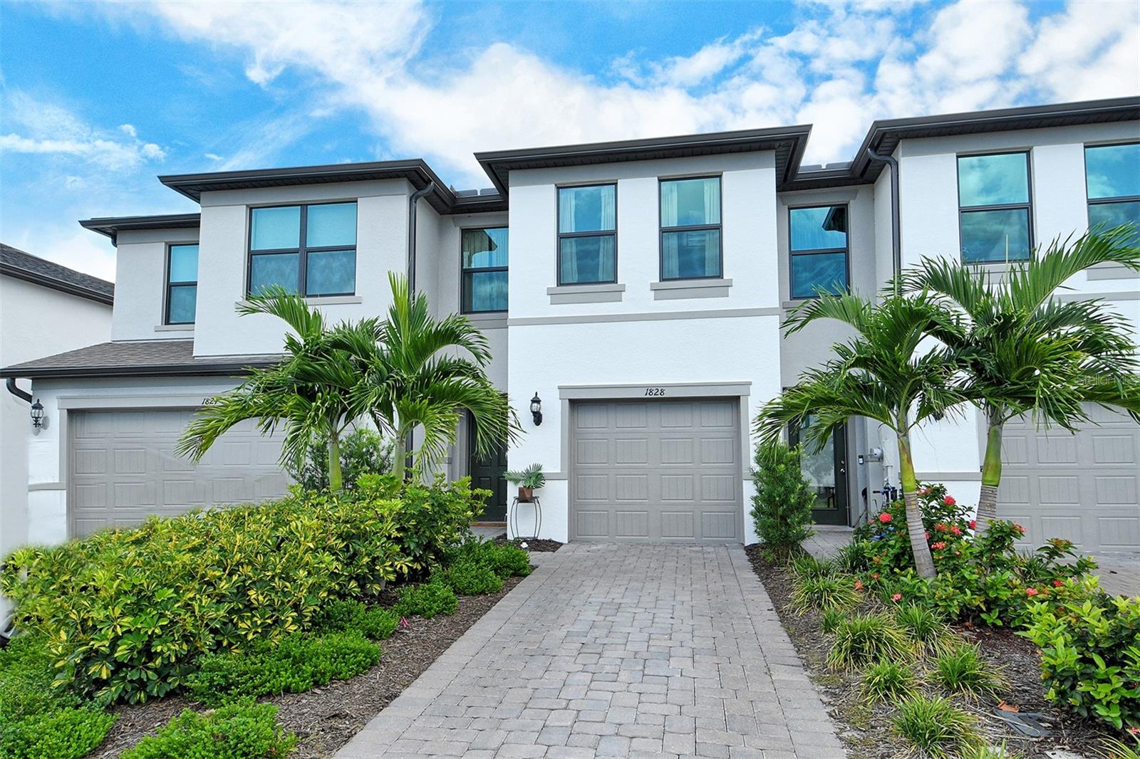 Welcome to 1828 Vanora Lane, a beautifully designed 3-bedroom, 2.5-bath townhome located in Avanti at Waterside, one of Lakewood Ranch’s most desirable NEW communities in Sarasota County. Nestled along a sparkling 146-acre lake within a thoughtfully planned neighborhood of only 166 homes, villas, and townhomes. Just completed in 2023, this nearly new residence blends modern comfort and low-maintenance living for unmatched convenience.
Step inside to a bright, open layout designed for today’s lifestyle. A private GARDEN VIEW provides a serene backdrop to the main living spaces, while the convenience of GARAGE parking enhances everyday ease and storage. Whether entertaining or enjoying a quiet evening at home, this townhome offers the perfect balance of style and function. Located outside of flood zone and with IMPACT WINDOWS up to the latest building code, you won't need to worry about sandbags or shutters during hurricane season!
Avanti at Waterside Place offers more than just a home—it offers a lifestyle. From here, you’re an easy walk or bike ride to Waterside Place Town Center, with its lakeside dining, boutique shopping, and year-round events. Publix, I-75, and the shopping and dining mecca of University Town Center Mall are within 3 miles, Downtown Sarasota is only 8 miles away, and the world-famous white-sand beaches of Sarasota are less than 30 minutes from your door. Healthcare, A-rated schools, and everyday conveniences are all close by, making this one of the most connected locations in the region.
Lakewood Ranch is the #1 multi-generational master planned community in the U.S. Come see why and experience the best of Lakewood Ranch living at 1828 Vanora Lane—where affordable convenience, location, and lifestyle come together!