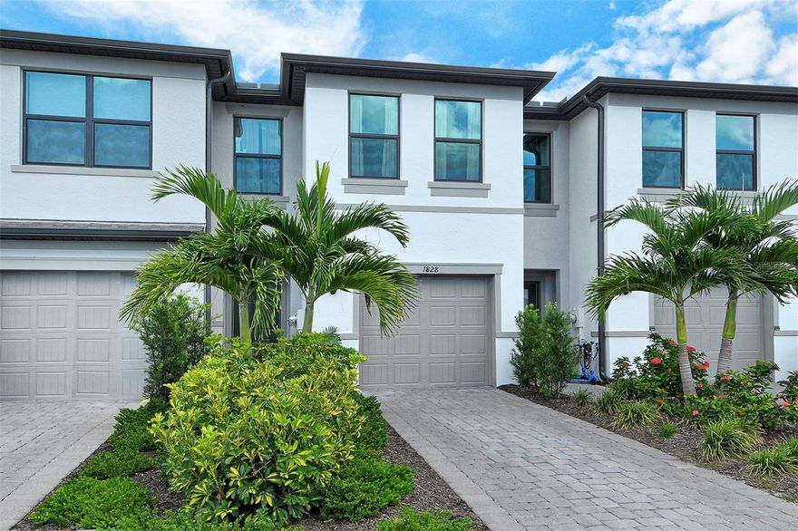 Located in Avanti at Waterside, this beautifully designed 3-bedroom, 2.5-bath townhome in one of Lakewood Ranch’s most desirable NEW communities in Sarasota County. Here you'll find LOW HOA fees with a private GARDEN VIEW that provides a serene backdrop to the main living spaces, while the convenience of GARAGE parking enhances everyday ease and storage. Whether entertaining or enjoying a quiet evening at home, this townhome offers the perfect balance of style and function. Located outside of flood zone and with IMPACT WINDOWS up to the latest building code, you won't need to worry about sandbags or shutters during hurricane season!

Avanti at Waterside Place offers more than just a home—it offers a lifestyle. From here, you’re an easy walk or bike ride to Waterside Place Town Center, with its lakeside dining, boutique shopping, and year-round events. Publix, I-75, and the shopping and dining mecca of University Town Center Mall are within 3 miles, Downtown Sarasota is only 8 miles away, and the world-famous white-sand beaches of Sarasota are less than 30 minutes from your door. Healthcare, A-rated schools, and everyday conveniences are all close by, making this one of the most connected locations in the region.

Lakewood Ranch is the #1 multi-generational master planned community in the U.S. Come see why and experience the best of Lakewood Ranch living at 1828 Vanora Lane—where affordable convenience, location, and lifestyle come together!