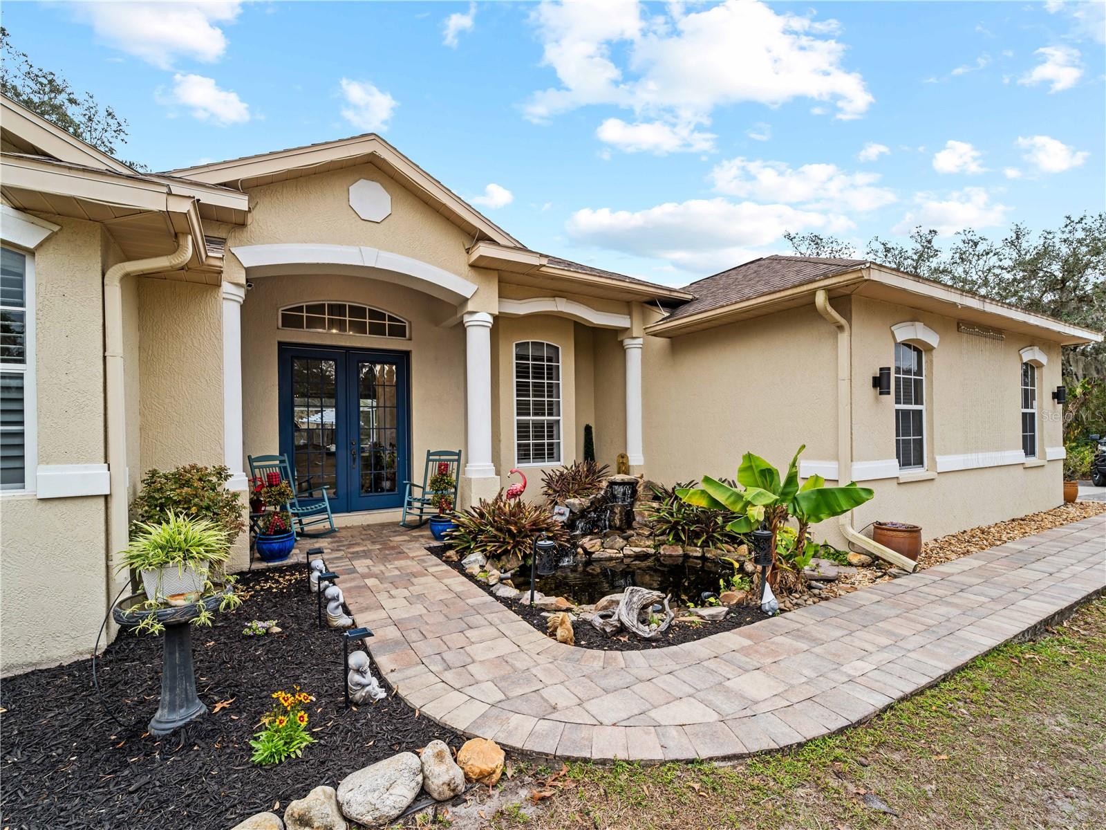Come live near everything the Lakewood Ranch area has, but with all the space that you need! Located in Saddlebag Creek Ranches, This Four bedroom, Three bath, Pool home is situated on a beautiful 5+ acre property! You are greeted by a Brand new $10,000 front gate installed in 2024 with a keypad for entry. Down the extensive driveway, take the sidewalk to the front door and pass by the beautiful Koi pond and lush landscaping. Walk through the large double front doors into the formal living room with its cathedral ceilings and sliders out to the lanai with beautiful pavers. The dining room, with its plantation shutters and ample space for all of your family gatherings. The beautifully remodeled kitchen is accented with a Reverse Osmosis water system and a breakfast bar to sit and enjoy conversations with the cook. Complemented by a walk in pantry, island work station and built in computer desk alongside the kitchen nook overlooking the pool through the aquarium window. There is a separate laundry room and another set of washer/dryers in the RV garage for all that dirty yard clothing! The Primary bedroom is very spacious and has His and Hers walk in closets, a large bathroom with two separate sinks, a vanity area, a Garden tub and a large walk in shower. Bedrooms 1 and 2 are located on the opposite end of the house in their own separate wing, with a shared bathroom in between and a pocket door for privacy. The Fourth bedroom is located off the Family room at the back of the house with an ensuite bathroom with walk in shower. This room can also be used as an office or den as well as the pool bathroom. There is a 30 x 16 Saltwater pool with new pool equipment. A new well pump was installed in 2024 for the septic tank. The garage is a very spacious 3 car side entry. Did I mention that the Roof is being replaced before closing? Further back into the yard there is a large pole barn (48 x 36) built in 2018 with (Three) 12 x 12 Stalls with automated water, (Two) 6 x 12 Mini stalls, a 12 x 12' Feed room and a 12 x 12 Tack room with storage above. The barn has a 12 x 36 covered front porch area to sit and enjoy your evening looking at the stars while enjoying a glass of wine. Opposite the pole barn is a 34 x 24 garage that can house your RV or Boat with a floor to ceiling 20' peak! The two front doors are 12 foot tall roll doors. The back door is 10 ft tall and the garage has an elevated 12 x 12 storage space and underneath that a workspace with dedicated electric for those late nights tinkering. You will also find in the garage a spare set of washer and dryers for all the dirty clothes from yard work! The entire perimeter of this property is fenced with field fencing and cross fenced as well. Along the front of the property it is four board fenced. There is water access for the pastures in multiple locations as well as a covered feed and water area for the cows and horses. The property has an irrigated garden area as well as fruit trees such as: Orange, Grapefruit, Tangerine, Fig, Mango, Guava and Avocado! Topping it off with a 2 1/2 mile wooded bridle trail within the neighborhood. The livestock is also available for purchase through a separate addendum. Come out and see this property and enjoy the fresh air before it is SOLD!