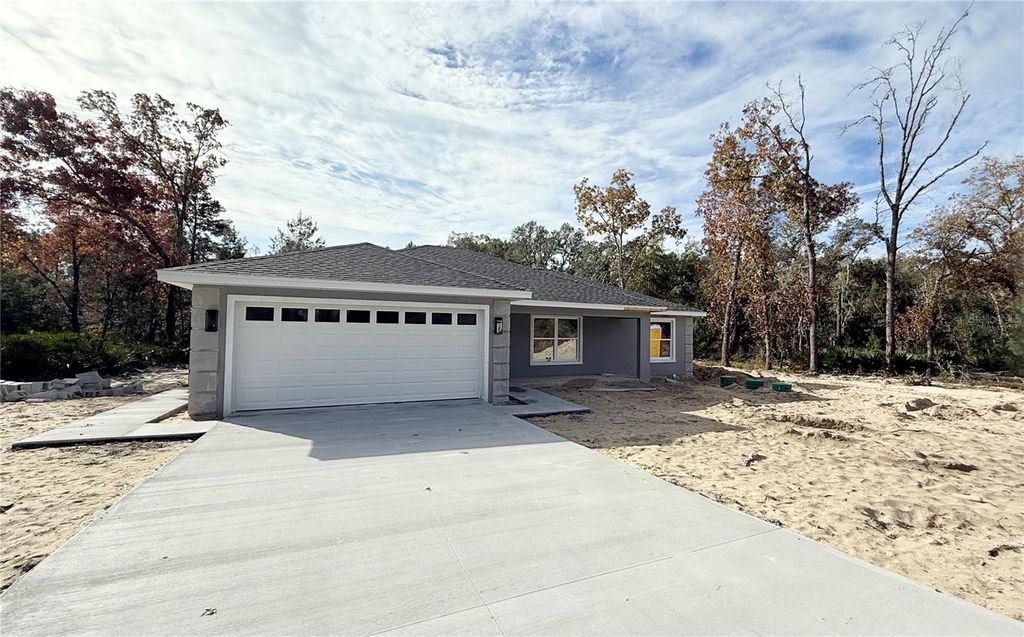 Photo of 120 Guava Pass, Ocklawaha, FL 32179 (MLS # OM715225)