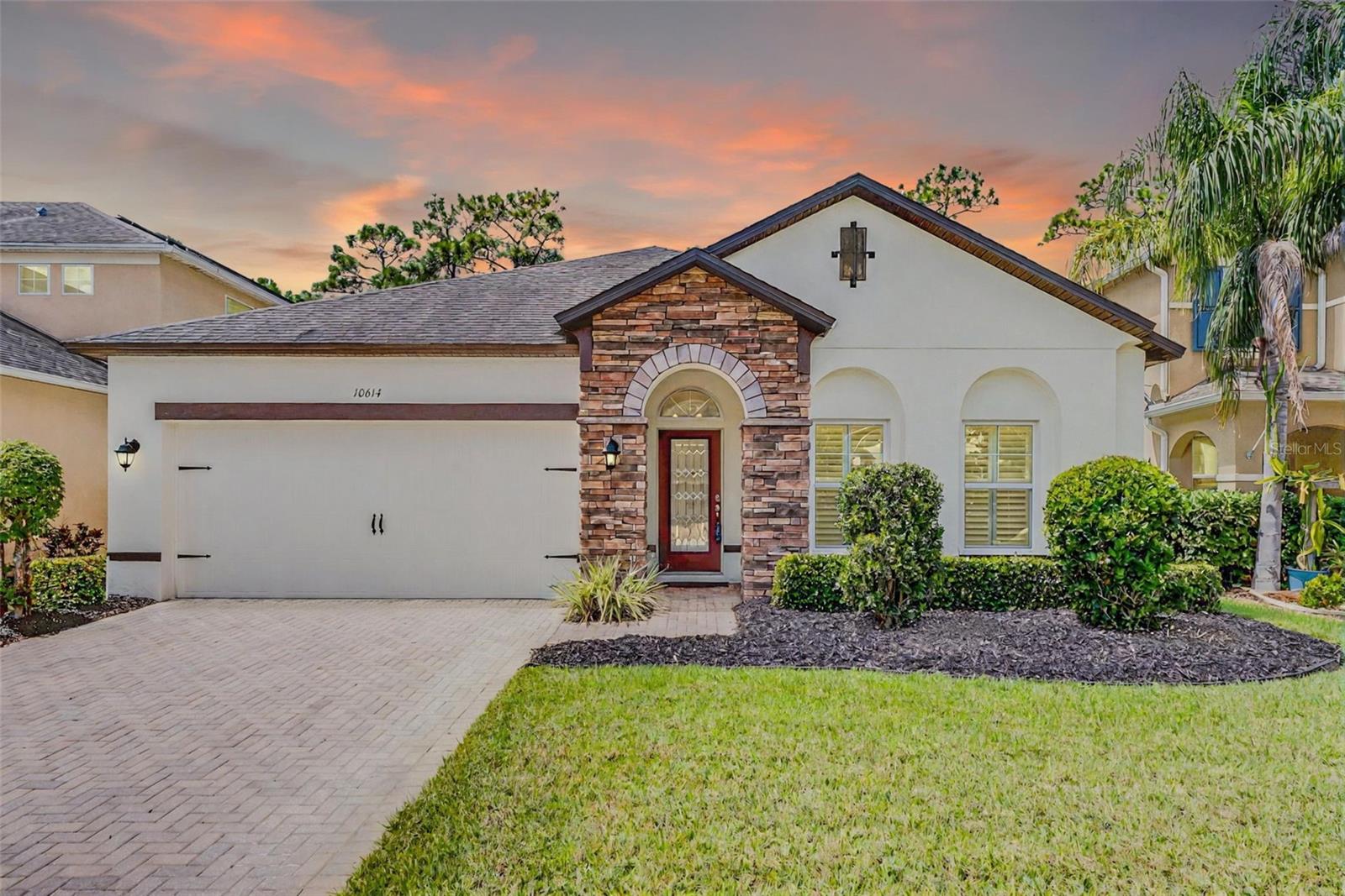 Welcome to 10614 Arbor View Blvd, Orlando, FL 32825, a prestigious residence in the highly sought-after Woodland Lakes Preserve community. Nestled within this secure guard-gated neighborhood, this stunning 4-bedroom, 2-bathroom home with a 2-car garage combines modern upgrades, thoughtful design, and a peaceful conservation setting that makes every day feel like a retreat. From the moment you arrive, the home’s curb appeal makes a lasting impression. Fresh exterior paint, lush landscaping, and vibrant mulch frame the front, setting the stage for what’s inside. Step through the front door and you’ll be greeted by an open floor plan that flows effortlessly from room to room. Water-resistant vinyl flooring stretches across the home, offering both durability and style. Details such as plantation shutters, ceiling fans, double-pane windows, and automatic blinds on the sliding glass doors enhance both comfort and sophistication. For added convenience, the washer and dryer are included. At the center of the home is a beautifully designed kitchen. Gleaming granite countertops, a striking designer mosaic backsplash, recessed lighting, and pendant fixtures bring style and function together. With 42” wood cabinetry, stainless steel appliances, a large island with breakfast bar seating, and a generous walk-in pantry, this kitchen is a dream for both everyday meals and entertaining. The open concept allows seamless flow into the family room, where conservation views create a serene backdrop. Step outside to the screened-in extended lanai and enjoy the ultimate private retreat. With no rear neighbors and only nature behind you, it’s the perfect space for morning coffee, evening dinners, or simply unwinding. The primary suite is spacious and inviting, complete with a walk-in closet and a spa-inspired bathroom featuring dual vanities, a soaking garden tub, and a separate shower. Additional bedrooms and bathroom are well-sized, offering flexibility and style throughout. An indoor laundry room, hybrid water heater, whole-home water softener, and reverse osmosis filtration system add even more convenience. Life in Woodland Lakes Preserve includes a variety of amenities: a sparkling community pool with sun deck, a covered playground, picnic areas, and sidewalks perfect for walking or jogging. The 24/7 staffed gate provides security, while the prime location places you just minutes from UCF, Waterford Lakes Town Center, Central Florida Research Park, Lockheed Martin, and major highways including SR408 and SR417. 10614 Arbor View Blvd isn’t just a house—it’s a lifestyle. With conservation views, high-end upgrades, and an unbeatable location, this home is truly a standout in Orlando real estate. Schedule your private showing today and experience all that Woodland Lakes Preserve has to offer!