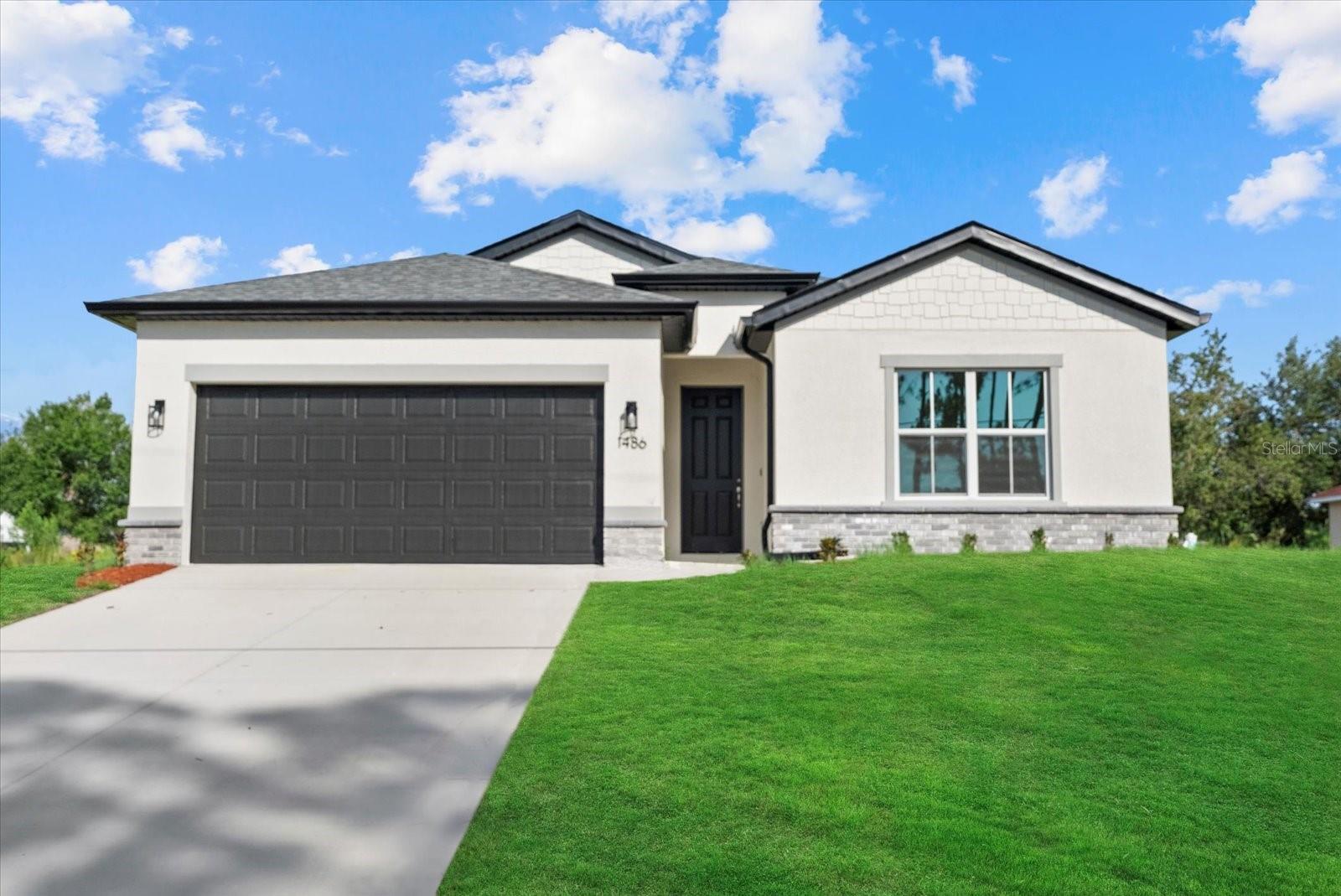 New Construction! Move-in Ready! Seller Concessions Available! This beautiful 4-bedroom, 3-bathroom home with a 2-car garage is ready for you to call home. Step inside and be greeted by the spacious great room with soaring 9'4'' ceilings and elegant 8' doors throughout. The modern kitchen INCLUDES a stainless-steel Samsung appliance package, beautiful quartz countertops, and an open layout perfect for entertaining. The Primary bedroom comes complete with a tray ceiling, dual walk-in closets, and a spa-like ensuite with double vanities. The fourth bedroom, located at the front of the house, offers privacy with its own ensuite bathroom, perfect for guests or extended family. This home is packed with high-end finishes, including hurricane-impact windows, tiled showers, stylish and durable flooring, irrigtion system, and a Ring doorbell. Enjoy Florida living year-round on the covered lanai, ideal for outdoor relaxation. Selling concessions are available to make your move even easier! No HOA fees, no CDD. Interior photos are from a another home with the same floorplan and finishes. Schedule your showing today!