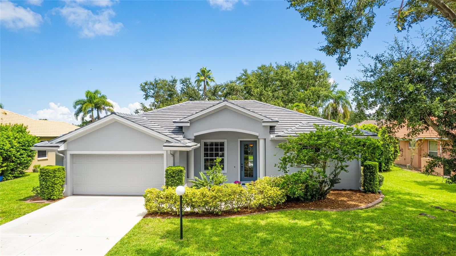 Beautifully updated, well-maintained, and ideally located, this 4-bedroom, 2-bath pool home in the desirable Three Oaks community offers the perfect blend of comfort, style, and peace of mind. Nestled on a quiet street with mature landscaping, the property is located in Flood Zone X (no flood insurance required) and has no CDD fee—a valuable combination.
Major updates have been completed for your convenience, including a NEW TILE ROOF (2024) with a transferable 20-year warranty, NEW pool pump and filter (2021), NEW salt cell (2024), and a fully refurbished pool cage with new screens, hardware, paint, and doors (2024). The home’s exterior was painted in 2019, and well irrigation helps keep the yard looking its best year-round.
Inside, the home is light and bright with high ceilings, a neutral palette, and an open layout that creates a welcoming, spacious feel. The kitchen features newer appliances and luxurious dolomite countertops, and flows easily into the family room—perfect for both everyday living and entertaining. A separate formal living room and formal dining room adds versatility, while sliding doors in the living areas and bedrooms lead directly to the screened lanai.
The spacious primary suite is a true retreat, offering double vanities, a walk-in closet, a soaking tub, and a separate walk-in shower as well as direct access to the pool. Three additional bedrooms provide plenty of space for family or guests with one having its own access to the pool.
Outside, the screened in lanai offers a private pool and multiple seating areas, all surrounded by lush, tropical landscaping—perfect for relaxing or hosting friends.
Located in a low-HOA, deed-restricted community, and just one mile from A-rated elementary and middle schools, this home is ideal for families looking to walk or bike to school. With easy access to I-75 and just minutes from downtown Sarasota, top-rated beaches, shopping, dining, and cultural attractions, this move-in-ready home truly has it all.