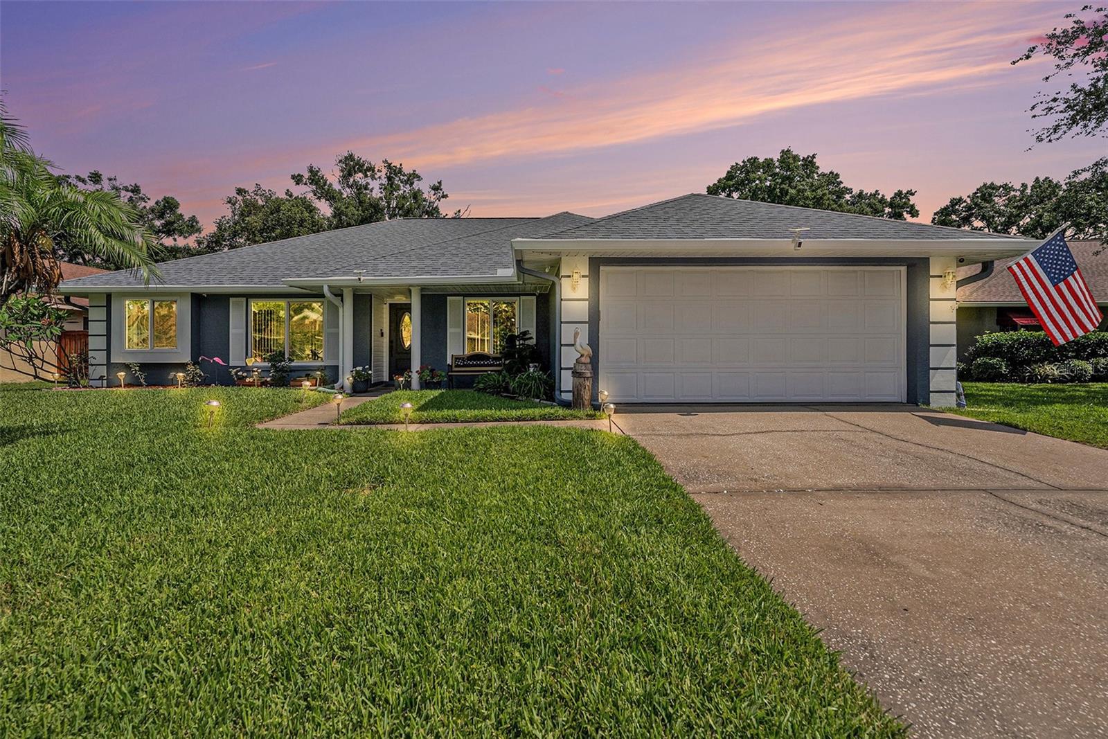 Welcome to this beautifully updated 3-bedroom, 2-bath ranch home nestled in a quiet neighborhood in Carrollwood Springs! Boasting a seamless blend of comfort, style, and functionality, this home offers the ideal Florida lifestyle with its spacious layout and inviting outdoor amenities. Step inside to find luxury vinyl plank (LVP) flooring flowing throughout the entire home, creating a cohesive and modern look. The expansive family room effortlessly connects to the dining area and a stunning, updated kitchen featuring chic newer cabinets, sleek quartz countertops, stainless steel appliances, and a convenient closet pantry—perfect for everyday living and entertaining. The private front living room offers versatility, making it an excellent option for a formal sitting area, dining room, or even a home office. The spacious primary suite is a serene escape, complete with an updated en-suite bathroom that includes dual vanities, a walk-in tiled shower, and two walk-in closets for ample storage. Step out back and enjoy your own tropical oasis! The covered back porch opens to a screened-in, built-in kidney-shaped saltwater pool—resurfaced in 2018 and upgraded with new LED lights and an energy-efficient variable-speed pump in the last year. Plus, an underground drainage line runs from the pump to the street to help manage heavy rain, adding peace of mind during Florida’s stormy seasons. The generous backyard is surrounded by mature trees for added privacy and features a designated gardening area, perfect for green thumbs. Don’t miss your opportunity to own this well-maintained, move-in ready home. Schedule your private showing today!