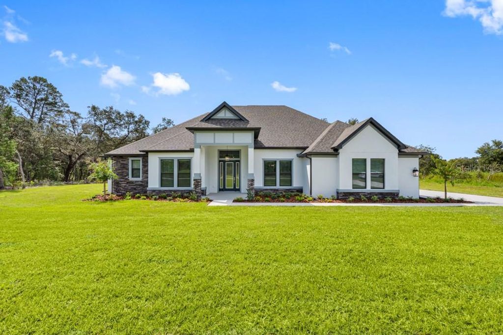 Photo of 13570 Saddlebred Lane, Hudson, FL 34667 (MLS # TB8403348)