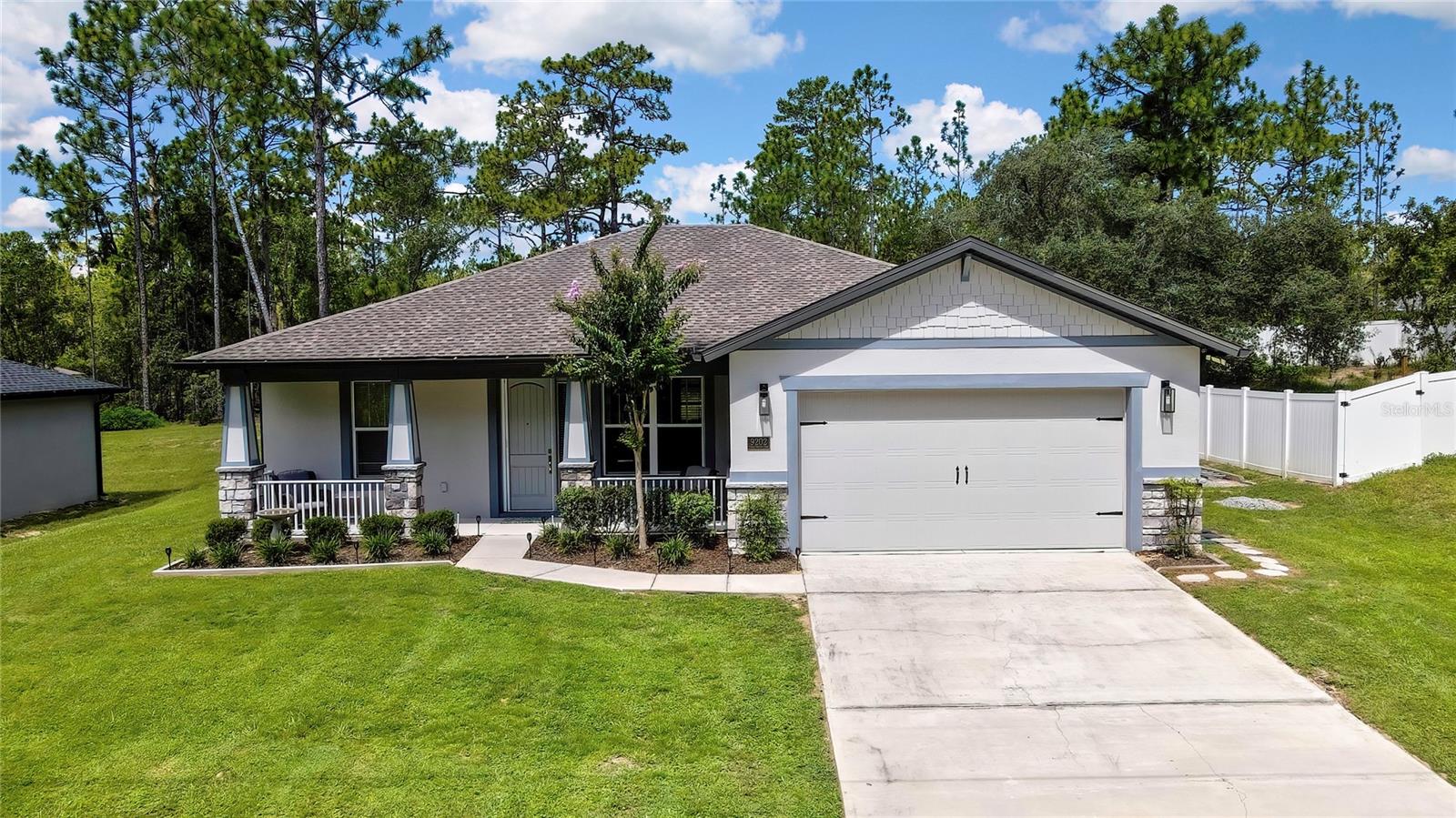 Custom 3 Bedroom, 2 Bathroom Home in Citrus Springs!
This stunning custom-built home (2020) offers a modern coastal feel with thoughtful upgrades throughout. Step inside to elevated ceilings with tray accents and an inviting electric fireplace that sets the tone for the open living area.
The kitchen is a chef’s dream, featuring upgraded cabinetry, quartz countertops, stainless steel appliances, pot filler, and a unique garage-style window that opens to the patio—perfect for entertaining. The spacious primary suite includes an en suite bathroom with a walk-in shower, dual sink vanity, and a walk-in closet. Two additional guest bedrooms are generously sized with hypoallergenic carpet.
Outdoor living is made easy with a covered patio, complete outdoor kitchen with granite countertops and beverage fridge, plus gutters around the entire home. The oversized two-car garage offers epoxy-sealed floors, a Wi-Fi-enabled insulated garage door, and ample storage. Additional features include CCTV pre-wired home with cameras, and a hideaway sliding screen at the front door to enjoy Florida’s best weather months.
This home is lightly lived in as a second home, this property feels nearly brand new. You won’t find another home like this in Citrus Springs—schedule your showing today!