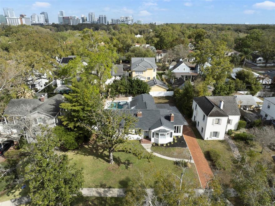 Location, location, location! This spacious home is ideally located just minutes from Lake Davis and enjoys the added benefit of being outside of the flood zone. The property offers three bedrooms, each with its own en-suite bathroom, plus a fourth full bath.
The welcoming living room features a wood-burning fireplace and flows into a large dining room, making it perfect for hosting gatherings. Original hardwood floors and a bright Florida room enhance the main living area. All bedrooms are spacious and filled with natural light.
At the back of the home, a separate family room with a second fireplace, its own kitchenette, and a full bathroom provides great flexibility and could easily function as a mother-in-law suite, guest quarters, or private living space, with direct access to the pool area.
Recent updates include a roof (2020), A/C and electrical updates (2020), exterior paint (2026), pavers, and a pool completed in 2025. With its versatile layout, thoughtful updates, and prime location near downtown Orlando and Lake Davis, this home offers a unique opportunity to enjoy comfort, convenience, and flexibility in one of the city’s most desirable areas.