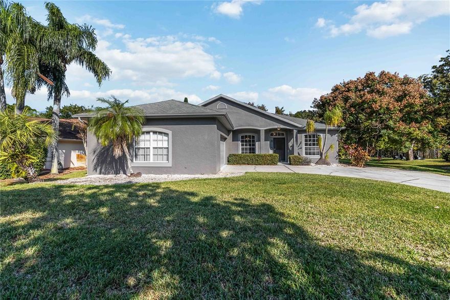 One or more photo(s) has been virtually staged. Welcome to 5676 Merlin Way, St. Cloud, located in the gorgeous gated community of Camelot.  Just minutes from a variety of shops and restaurants and easy access to the Florida Turnpike, which makes getting to Orlando International Airport, the Lake Nona area and the many Central Florida attractions very convenient.  The home features high ceilings, spacious bedrooms, split floorplan and a large, screened-in patio.  It needs TLC and some cosmetic updates and just waiting for your personal touch!  A lovely backyard with no rear neighbors, mature landscaping and a fenced in area for pets.  A NEW ROOF WILL BE INSTALLED PRIOR TO CLOSING; additionally, the A/C was installed in 2019 and the water heater, 2015.  This is a MUST SEE!  Don't wait, schedule your private showing today!