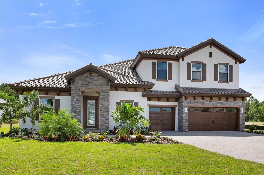Photo of 10065 Meadowrun Drive, Lithia, FL 33547 (MLS # J988385)