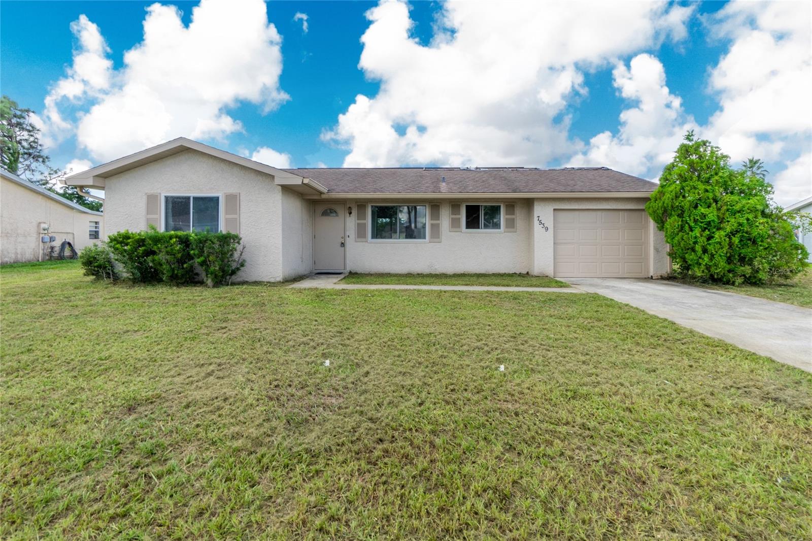 NEW ROOF (installed NOVEMBER, 2023) with 10 YEAR TRANSFERRABLE WARRANTY! Two bedroom one bath home with TONS of potential situated on a HUGE lot in a quiet neighborhood with sidewalks. Located very close to all of the conveniences North Port has to offer! Newly remodeled bath with grab bars. Windows have been updated. Ceiling fans. Electrical panel upgraded 2018. Home has been completely repiped. Attached garage. Private tranquil screened back patio overlooks very large back yard. Boat/RV parking allowed on property…No HOA! All appliances included. NO flood insurance required. Tamiami Trail is a five minute drive and offers a wide array of dining options, shopping, entertainment, hotels and health care services. Home is located close to beaches, golf, State College of Florida, Warm Mineral Springs and the Atlanta Braves spring training facility. Great starter or snow bird home!