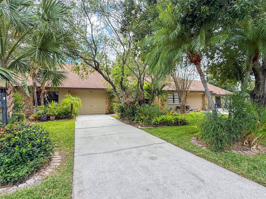 Welcome to Lake Seminole Village! This light and bright 3BR/2BA all-ages villa features vaulted ceilings, neutral luxury vinyl plank flooring, and a brand-new eat-in kitchen with quartz counters, solid wood cabinetry, stainless steel appliances, and breakfast bar. Large Split-bedroom layout with private master suite, walk-in closet, and ensuite bath with shower. Additional highlights include a wood-burning fireplace with stone facade, indoor laundry with sink, abundant storage options, a beautifully appointed guest bathroom with tub, and a one-car garage. Enjoy a screened front porch, rear screened patio with storage, and a fenced backyard surrounded by mature trees for privacy. Gorgeous landscaping front and back complete this move-in ready home in a highly sought-after community! Low HOA of only $369 covers the roof, exterior building insurance/maintenance, landscaping, pool maintenance, escrow reserves, and cable/internet! This unit is considered a PUD, not a condo, therefor residents pay all their own utilities.