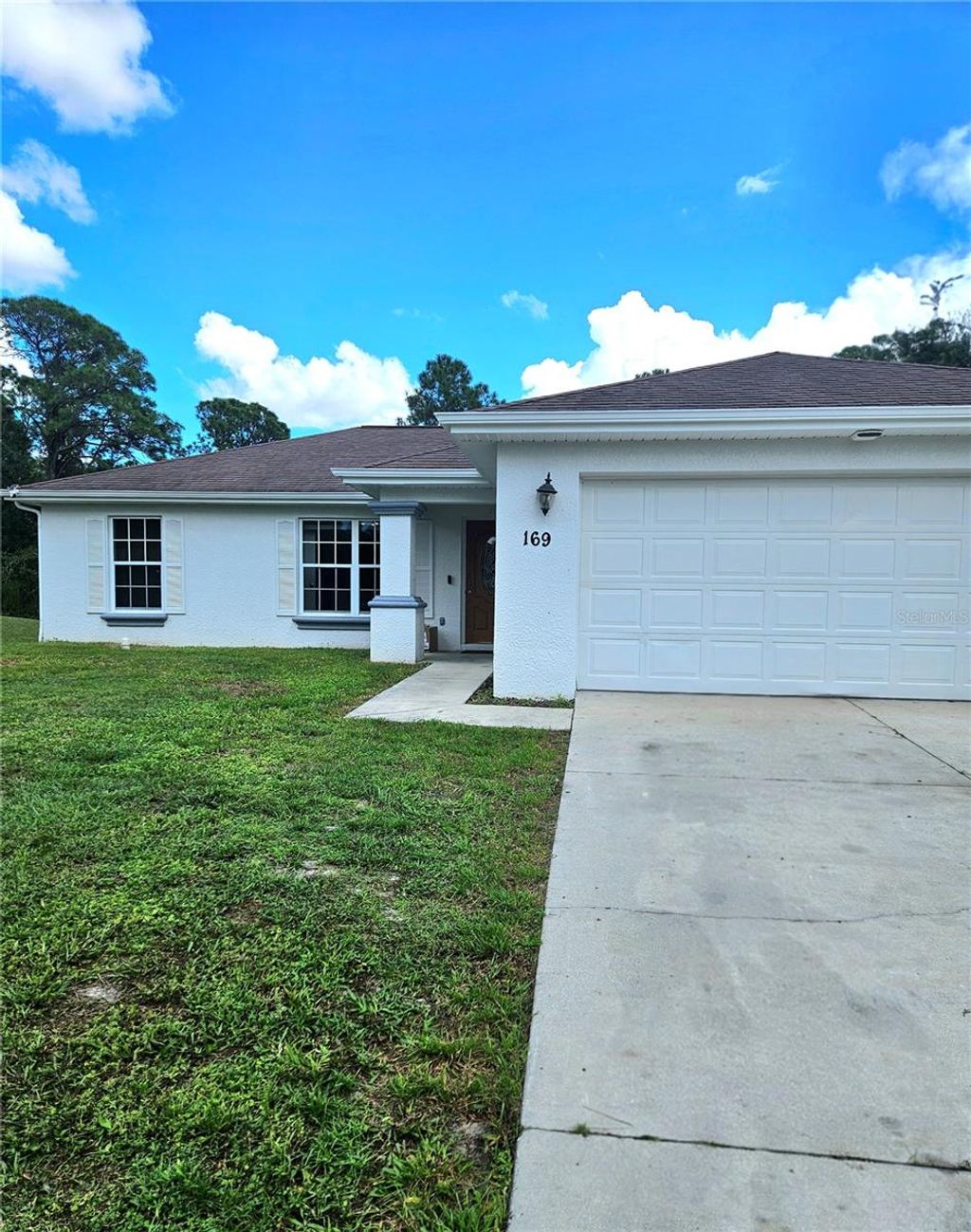 Photo of 169 Brown Avenue S, Lehigh Acres, FL 33974 (MLS # C7515431)