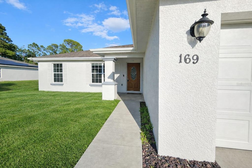 Photo of 169 Brown Avenue S, Lehigh Acres, FL 33974 (MLS # C7515431)