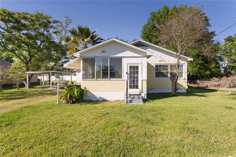 Photo of 311 E Wallace Street, Orlando, FL 32809 (MLS # O6292103)