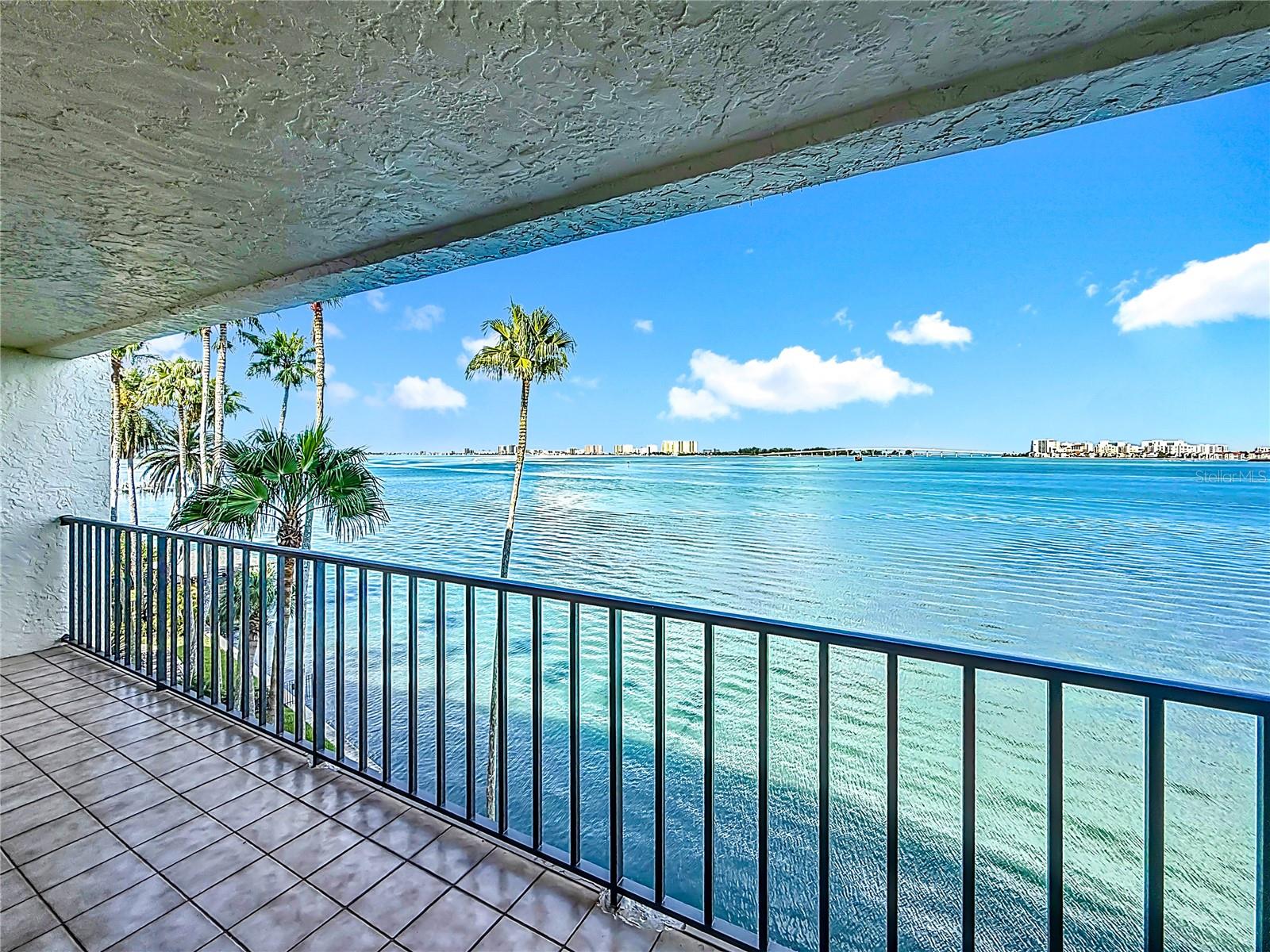 Breathtaking Waterfront Condo - with Endless Potential! This is a truly special waterfront condo, it all begins with the Spectacular View. A 4th floor condo in a 6 story building. Perfectly located just south of downtown Clearwater, this is a front row balcony seat directly on expansive Clearwater Bay, with Clearwater Beach and Sand Key in the distance, along with the Bridge to Island Estates, frames the Florida waterfront sunshine and the sunsets, perfectly.
With 2,170 SqFt and nearly 50 ft of balcony, this 2 bedroom, 2 bath condo has so much to offer - formal entry gives way to spacious Living / Dining room - to the left is the Kitchen, with large pantry and 'workshop" closets. The Kitchen flows into a spacious family room/ office, with one of 2 separate balconies overlooking the Bay, there's even plumbing in the wall for a bar. The primary bedroom to the right of the living room, they share the larger balcony. The primary suite has 2 walk-in closets, a spacious luxurious bath with separate tub and shower, double vanity and impressive storage space. The 2nd bedroom with a well appointed walk-in closet is across from the guest bath with a tub / shower. Of great convenience is the large laundry room with full size appliances and a utility sink. New HVAC complete system installed thanks to Milton, and a Brand new Roof on the bldg. HOA Reserves are funded, SIRS and Milestone inspections completed. Viewpoint-on-the-Bay has just been freshly painted, the seawalll completed in 2022 and All known assessments have been paid in full. Condo has hurricane shutters for all sliding doors, separate storage cage and assigned under building parking. You may not feel the need to leave the Balcony, but take time to enjoy the Resort style heated pool overlooking Clearwater Bay. All ages welcome, but sorry, no pets. Hurry, This One won't last !