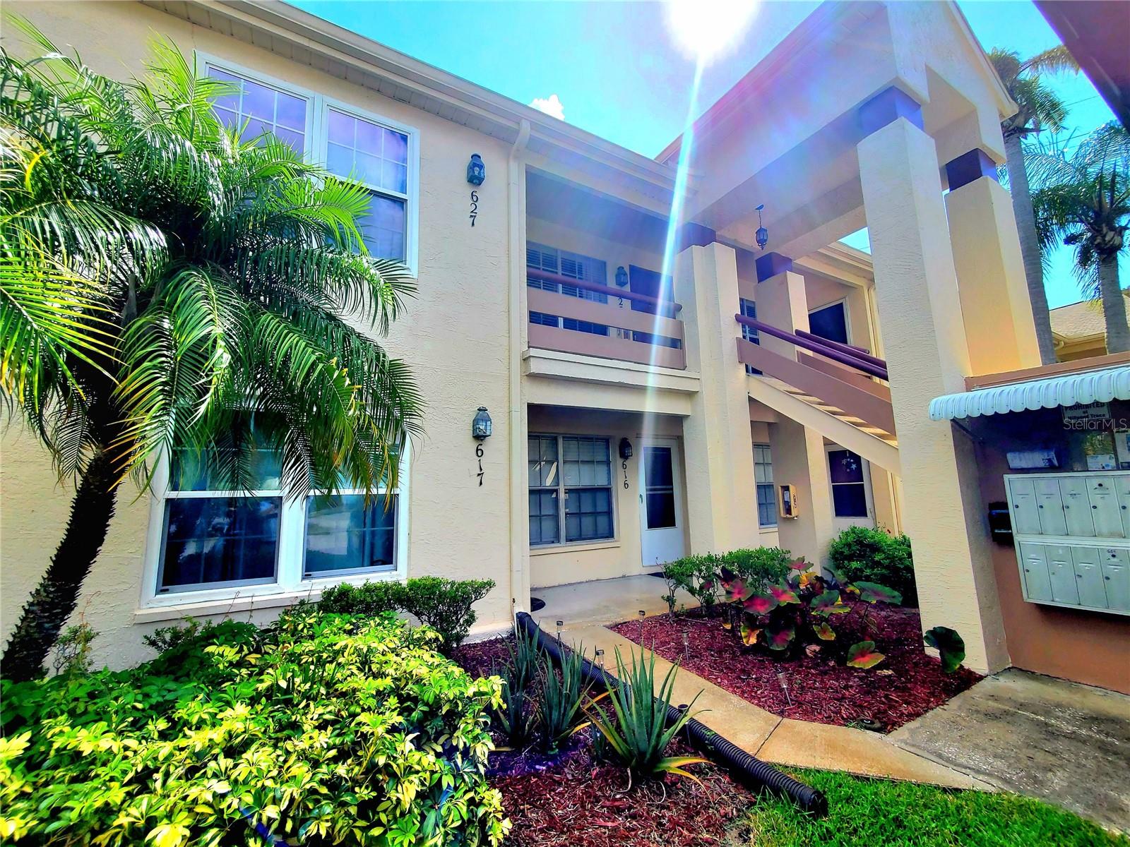 ** REMODELED 1ST FLOOR CONDO! ** Beautifully renovated condo on 1st floor with covered parking! Updated vinyl flooring throughout! Recently renovated kitchen with all new cabinetry, granite counters, and stainless steel appliances! Eat-in dinette area plus large closet pantry for storage! Unique from most floor plans in Mill Pond Trace, this condo has a double-door den/2nd bedroom (no closet) just off the family room! Great for an at-home office or guest bedroom! Master bedroom tucked away in the back with a scenic view out the window! Newly renovated bathroom with walk-in shower with sliding glass door, new vanity, lighting, and mirror! Inside laundry with stackable washer/dryer! Lots of closet space for a condo! Back patio is enclosed with tinted windows....slide them back to make it a screen lanai! Lanai has incredible view out the back of a greenbelt and pond area....no buildings! Community pool just down the road along with clubhouse and fitness center! (New closet doors in the process of being installed throughout the condo similara to the pantry doors)