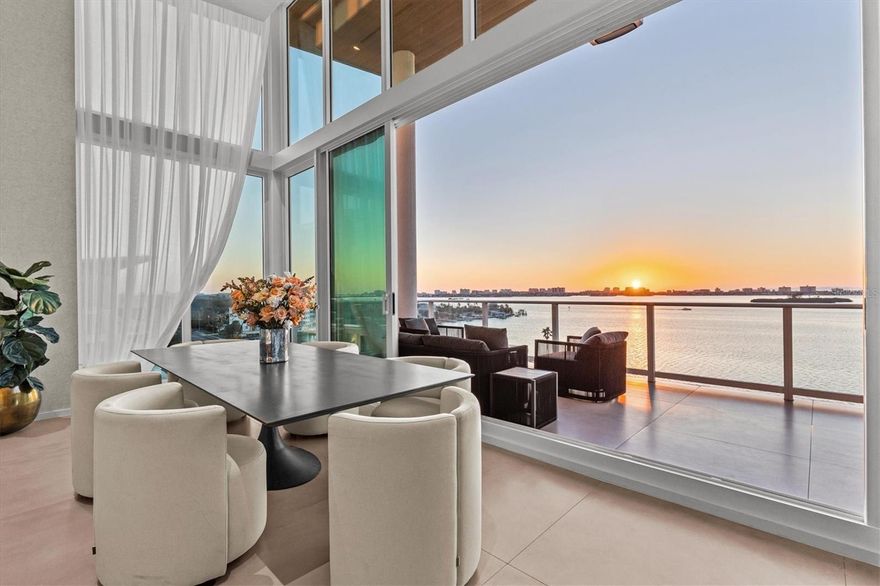 One or more photo(s) has been virtually staged. PRICE ADJUSTMENT to $4,800,000—supported by a recent appraisal. Listing price includes over $200,000 worth of furnishings and electronics. Sky Penthouse 703 at Serena by the Sea, a fully furnished and turn-key residence, delivers rare 16’+ ceilings, floor-to-ceiling glass, and unobstructed Gulf-to-Intracoastal panoramas. Retractable sliders open to colossal west facing terrace with no adjacent balconies for true privacy. 3 ensuite bedrooms + office + theater + flex room. Italian kitchen with waterfall stone and full Gaggenau suite appliances. Whole-home automation wiring, integrated audio, and electric blackout shades. Spa-style primary bath with soaking tub; large laundry; climate-controlled storage; three parking spaces next to the private elevator lobby. 23,000± SQFT resident-only amenities: zero-edge heated saltwater pool with cabanas, outdoor kitchen & sunset fire pit; modern fitness center; European-style spa with sauna, cold-plunge bucket, massage suites, jacuzzi & relaxation lounge. Exclusive access to concierge wellness services via a preferred provider. Marina in progress with priority slip rights for PH703.