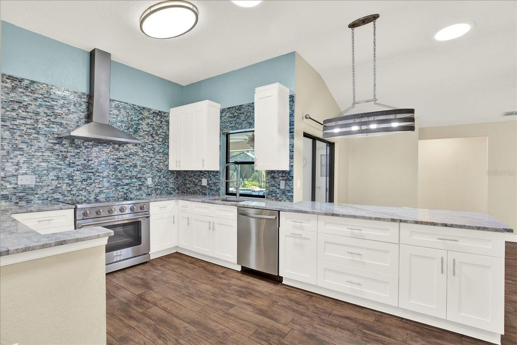 Photo of 447 Whispering Lakes Boulevard, Tarpon Springs, FL 34688 (MLS # TB8473439)